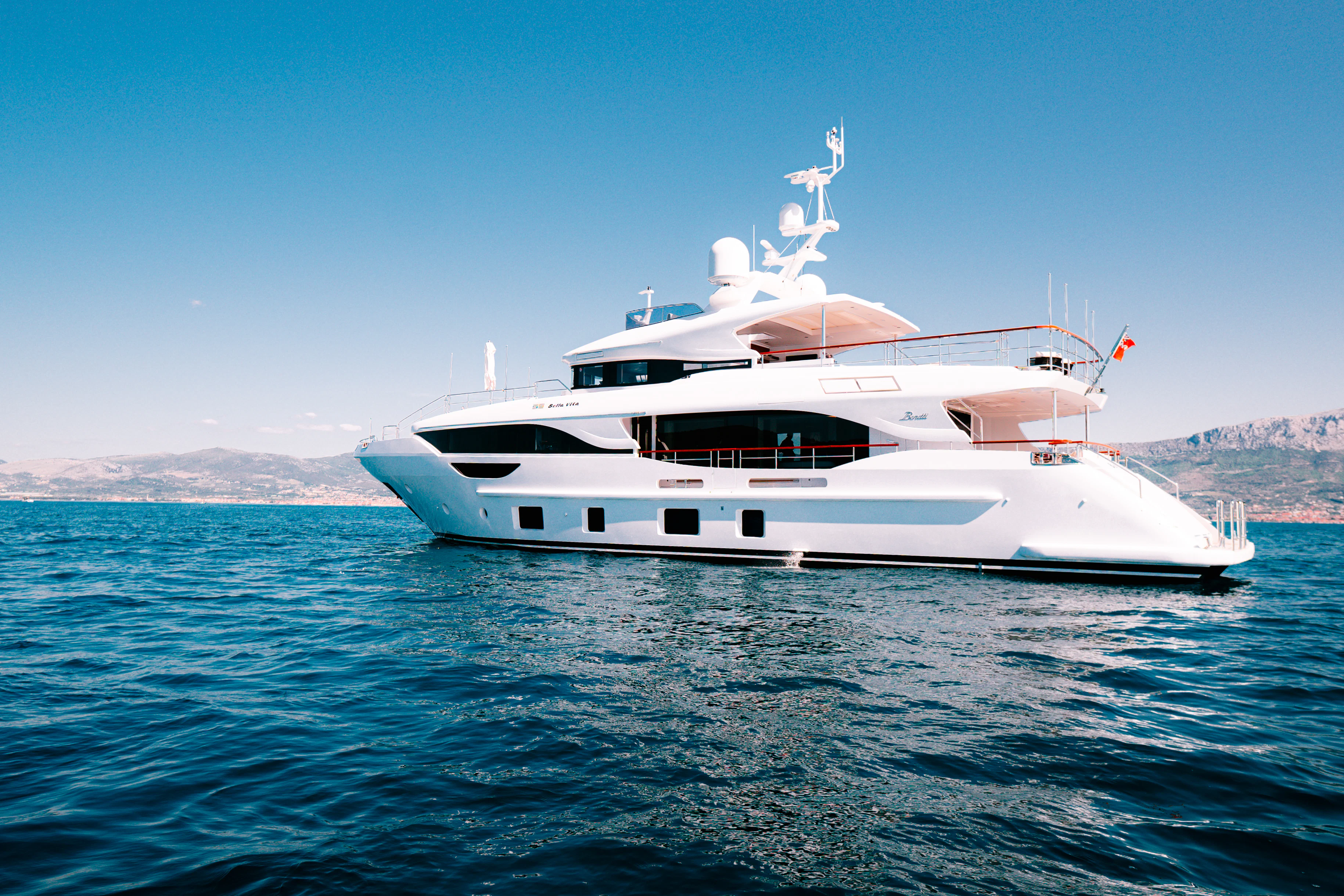 a white boat in the water aboard BELLA VITA Yacht for Charter