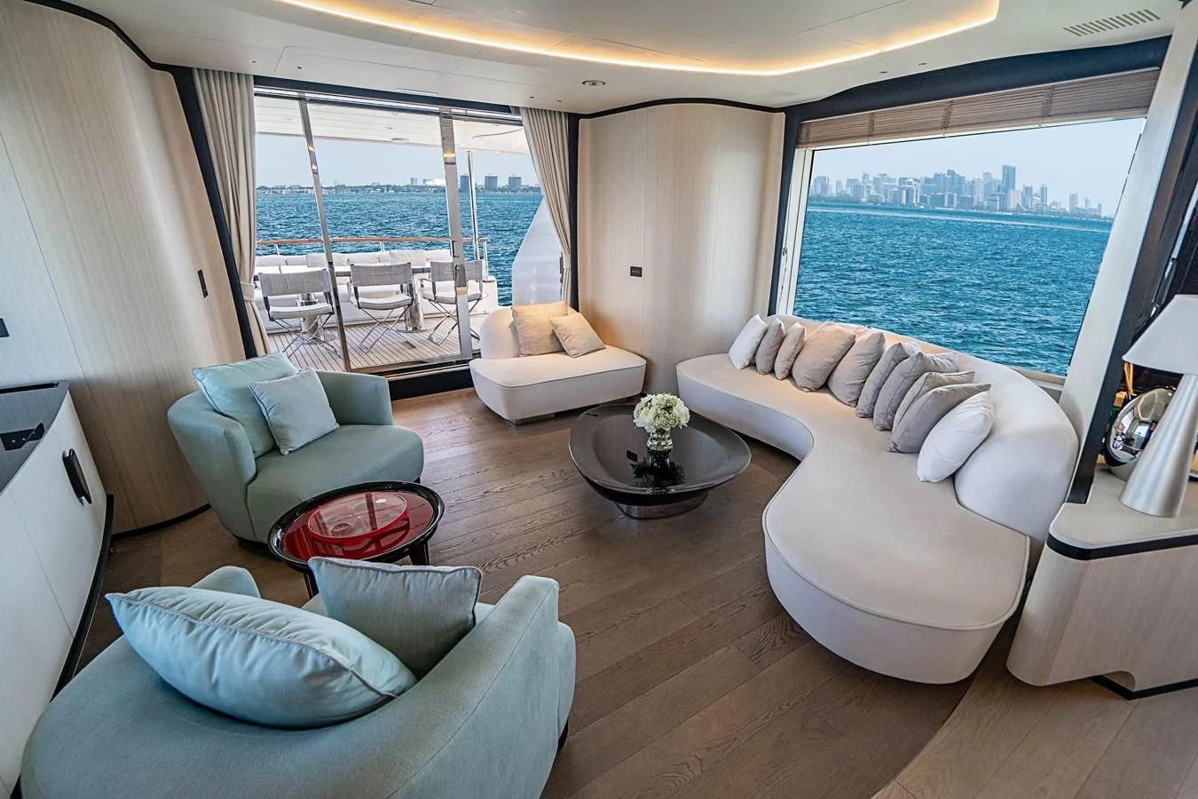a living room with a large window aboard BELLA VITA Yacht for Charter