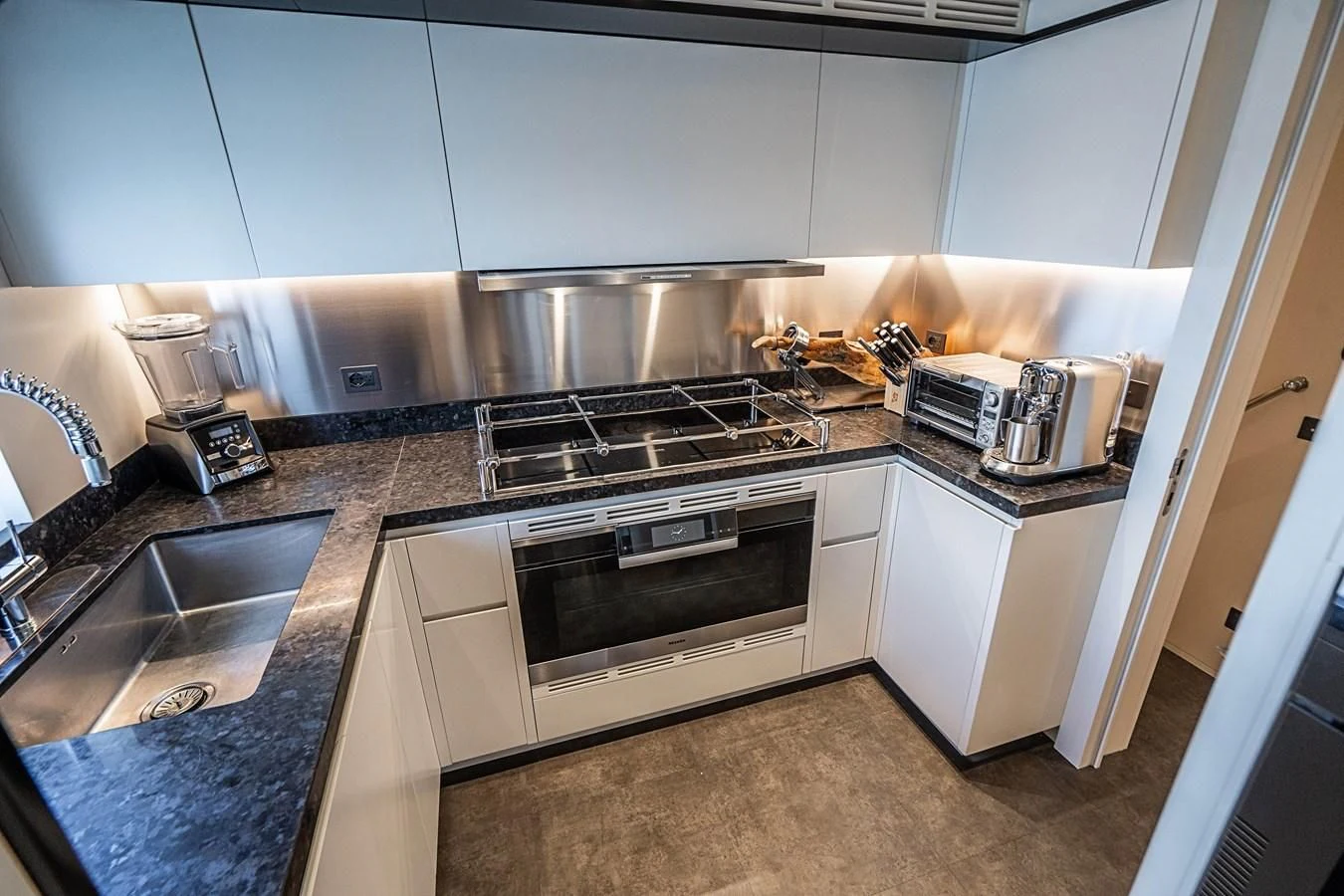 a kitchen with stainless steel appliances aboard BELLA VITA Yacht for Charter