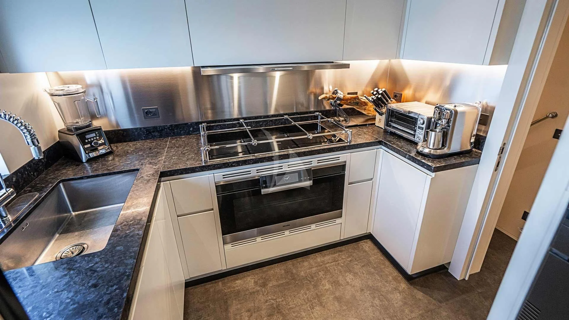 a kitchen with stainless steel appliances aboard BELLA VITA Yacht for Charter