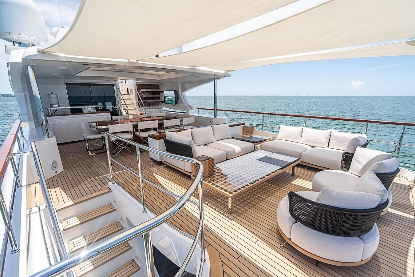 a large living room with a balcony aboard BELLA VITA Yacht for Charter