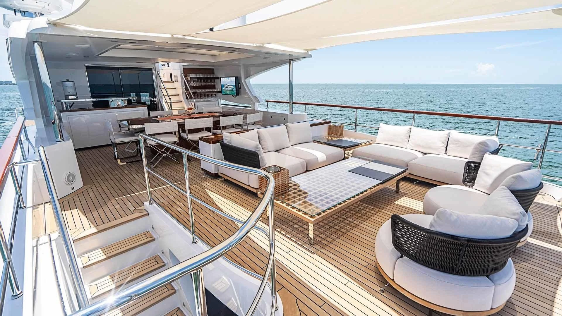 a large living room with a balcony aboard BELLA VITA Yacht for Charter