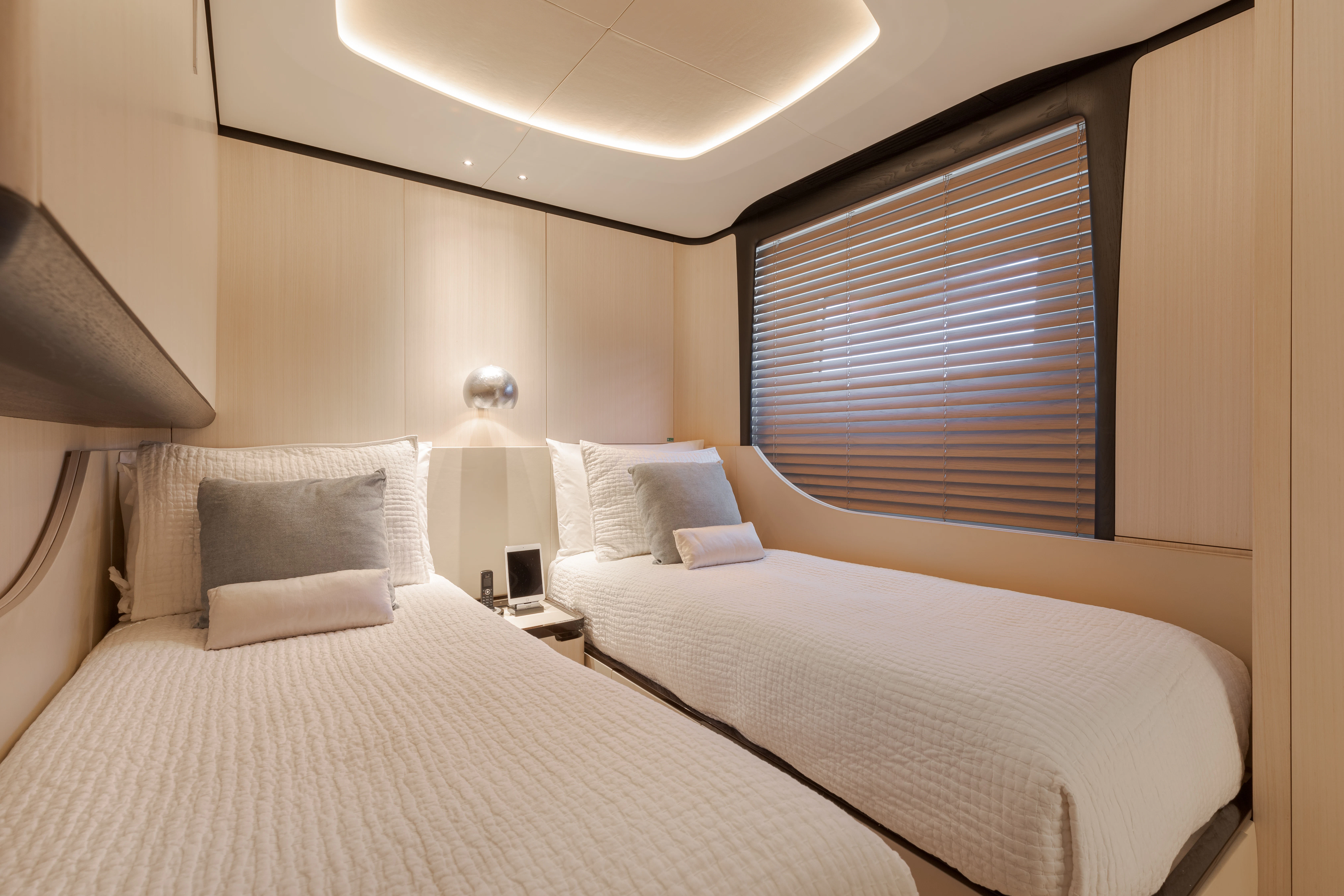 a couple of beds in a hotel room aboard BELLA VITA Yacht for Charter