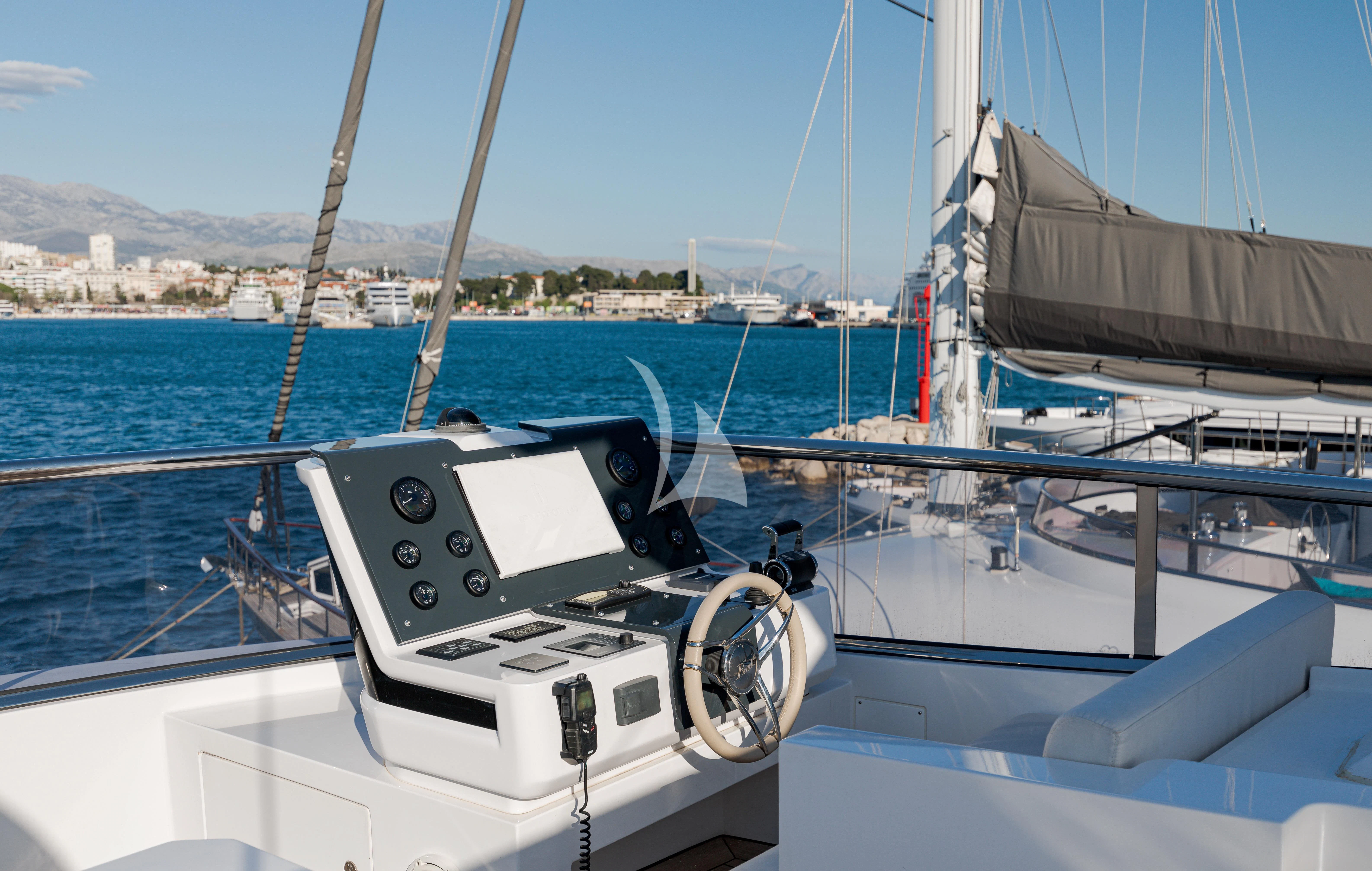 a boat with a steering wheel aboard BELLA VITA Yacht for Charter