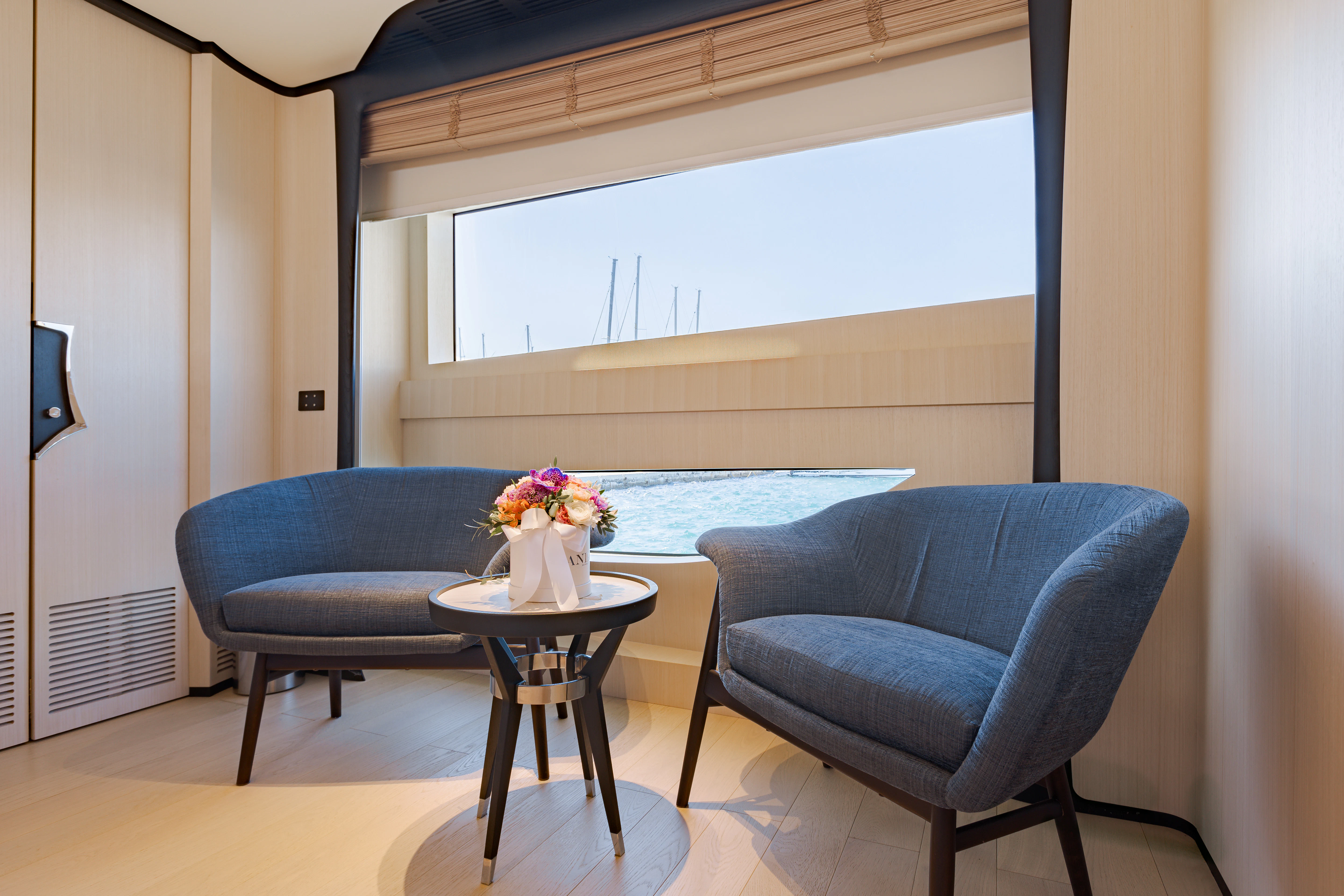 a living room with a couch and a coffee table aboard BELLA VITA Yacht for Charter