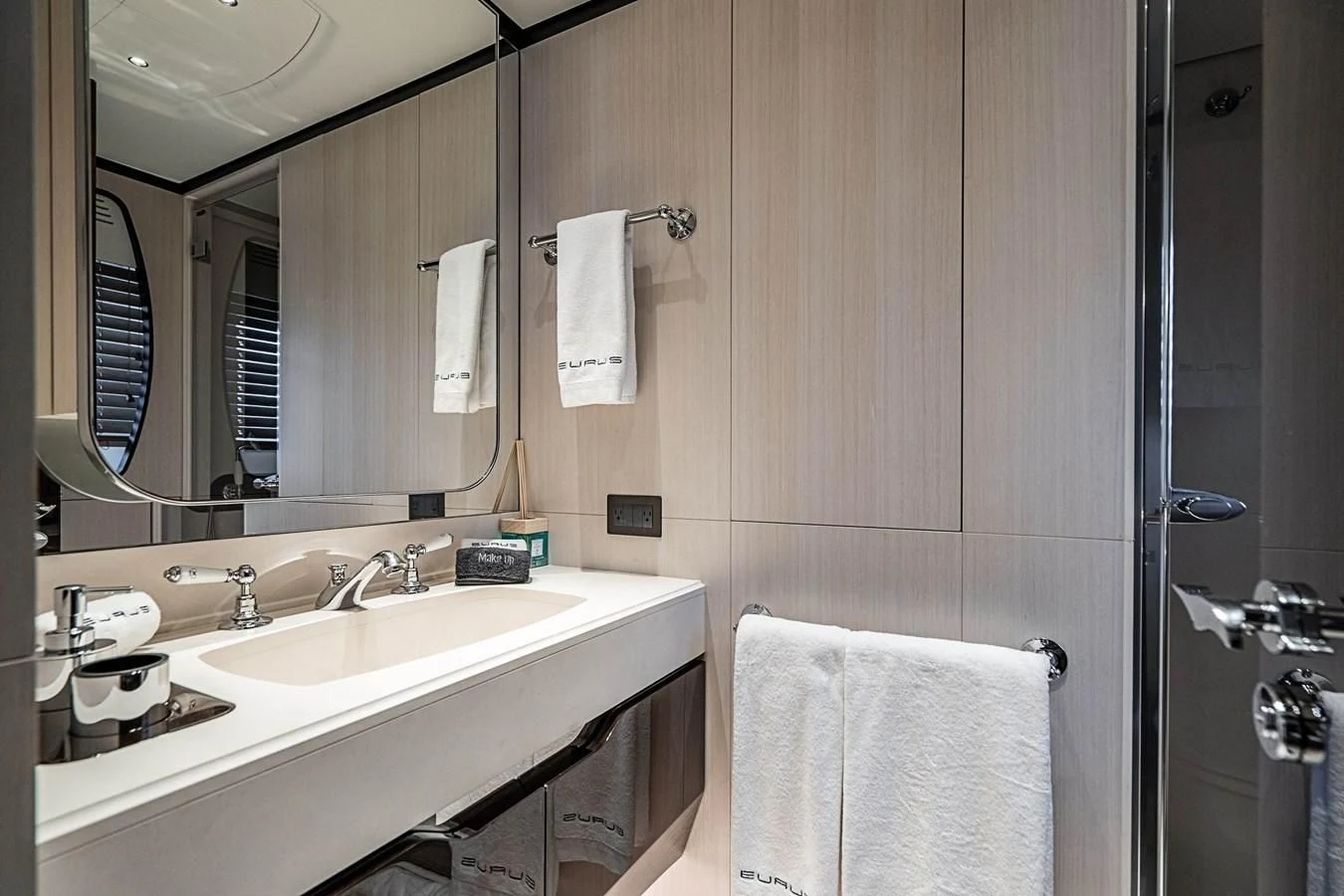 a bathroom with a sink and a mirror aboard BELLA VITA Yacht for Charter