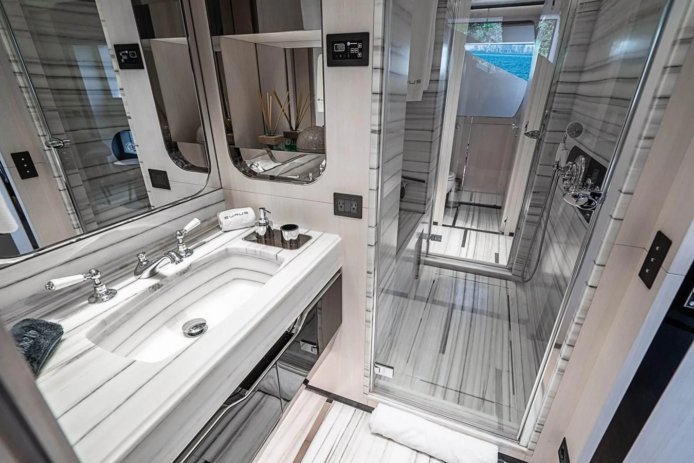 a bathroom with a large mirror aboard BELLA VITA Yacht for Charter