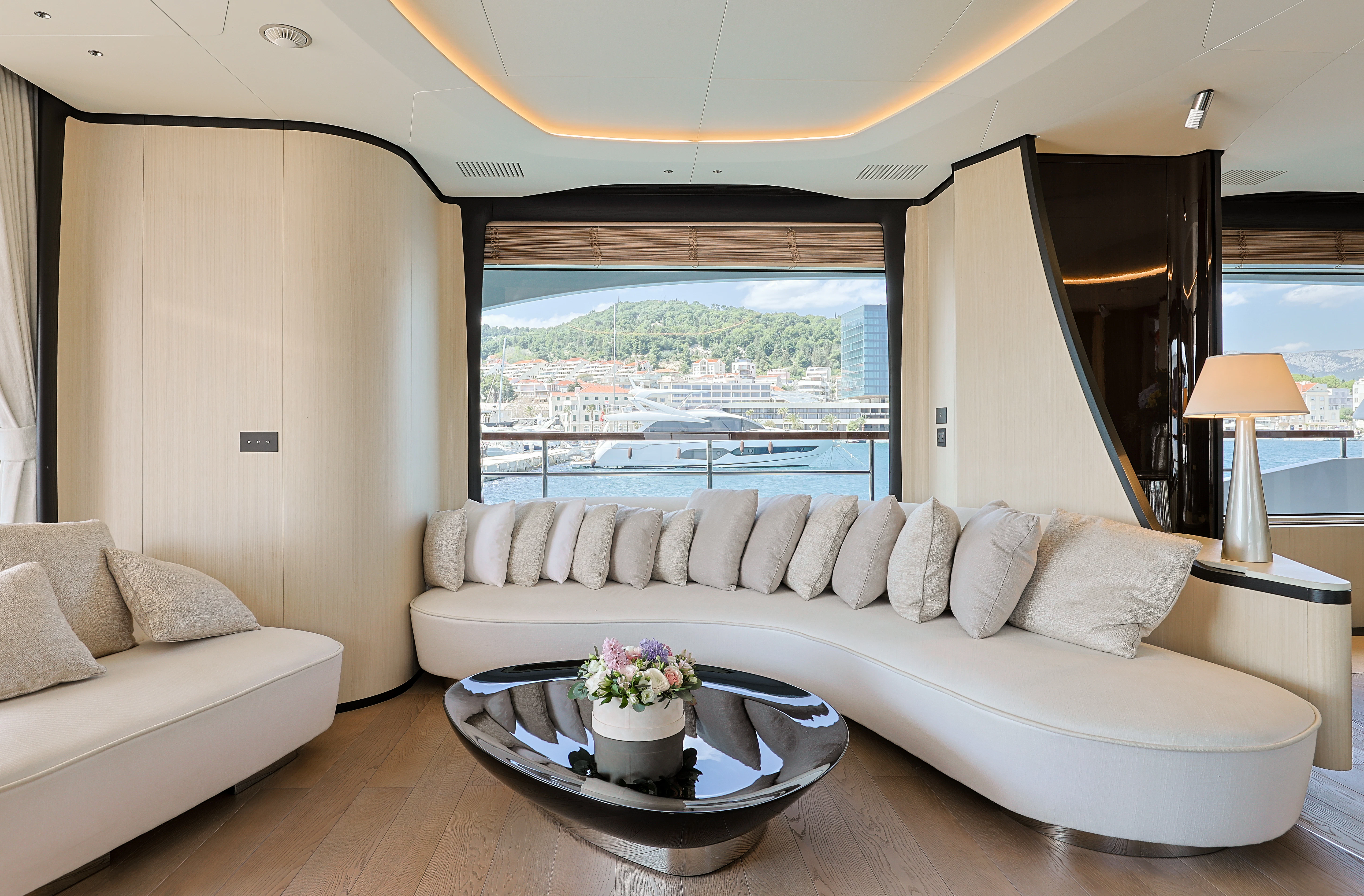 a living room with a large window aboard BELLA VITA Yacht for Charter
