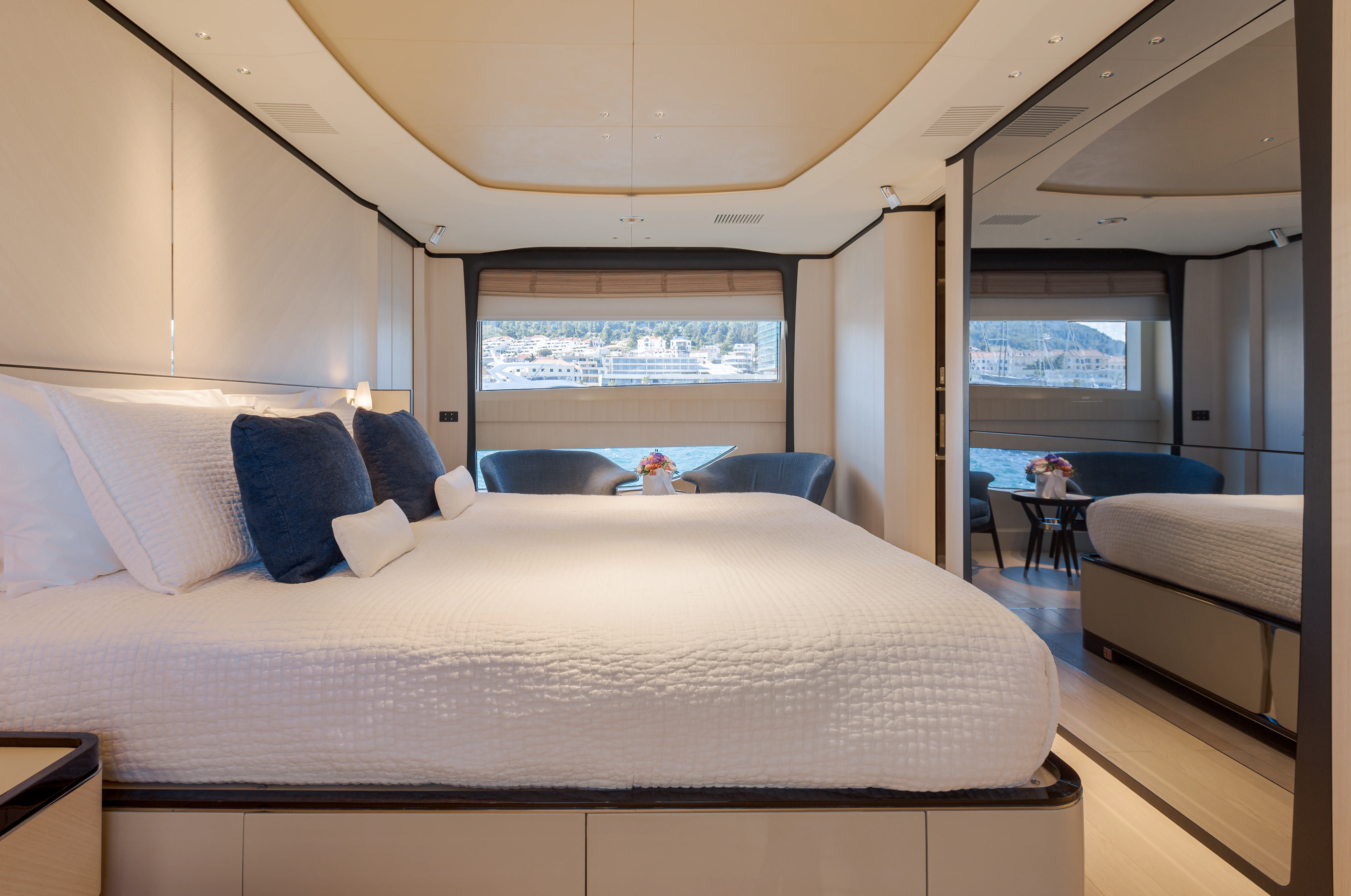 a large bed with a white bed aboard BELLA VITA Yacht for Charter