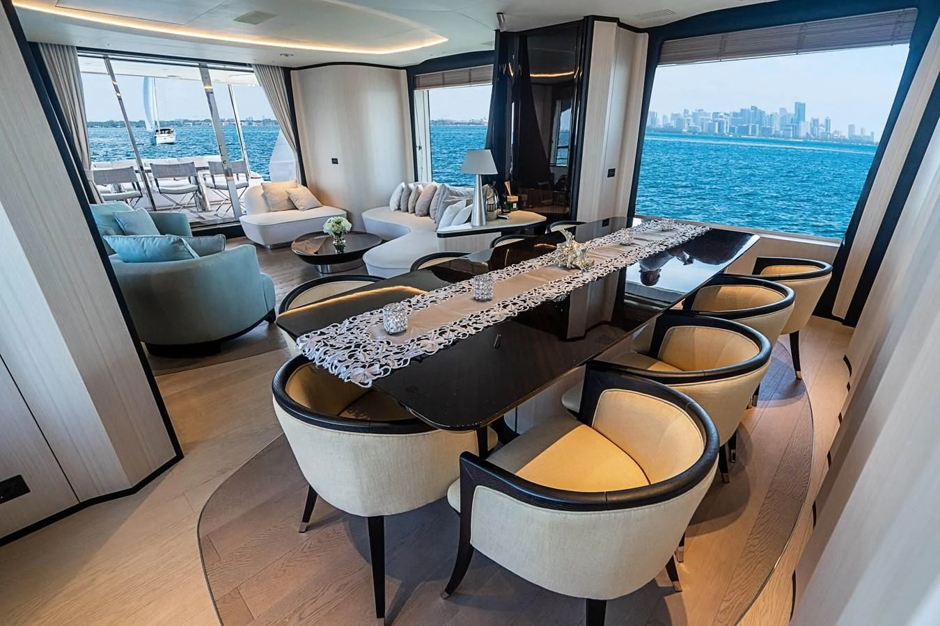 a room with a view of the ocean and a city aboard BELLA VITA Yacht for Charter