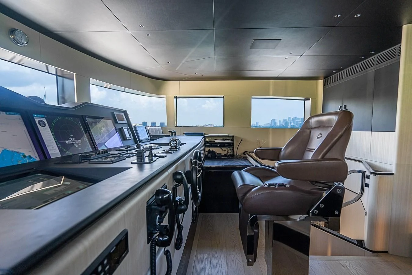 a room with a desk and chairs aboard BELLA VITA Yacht for Charter