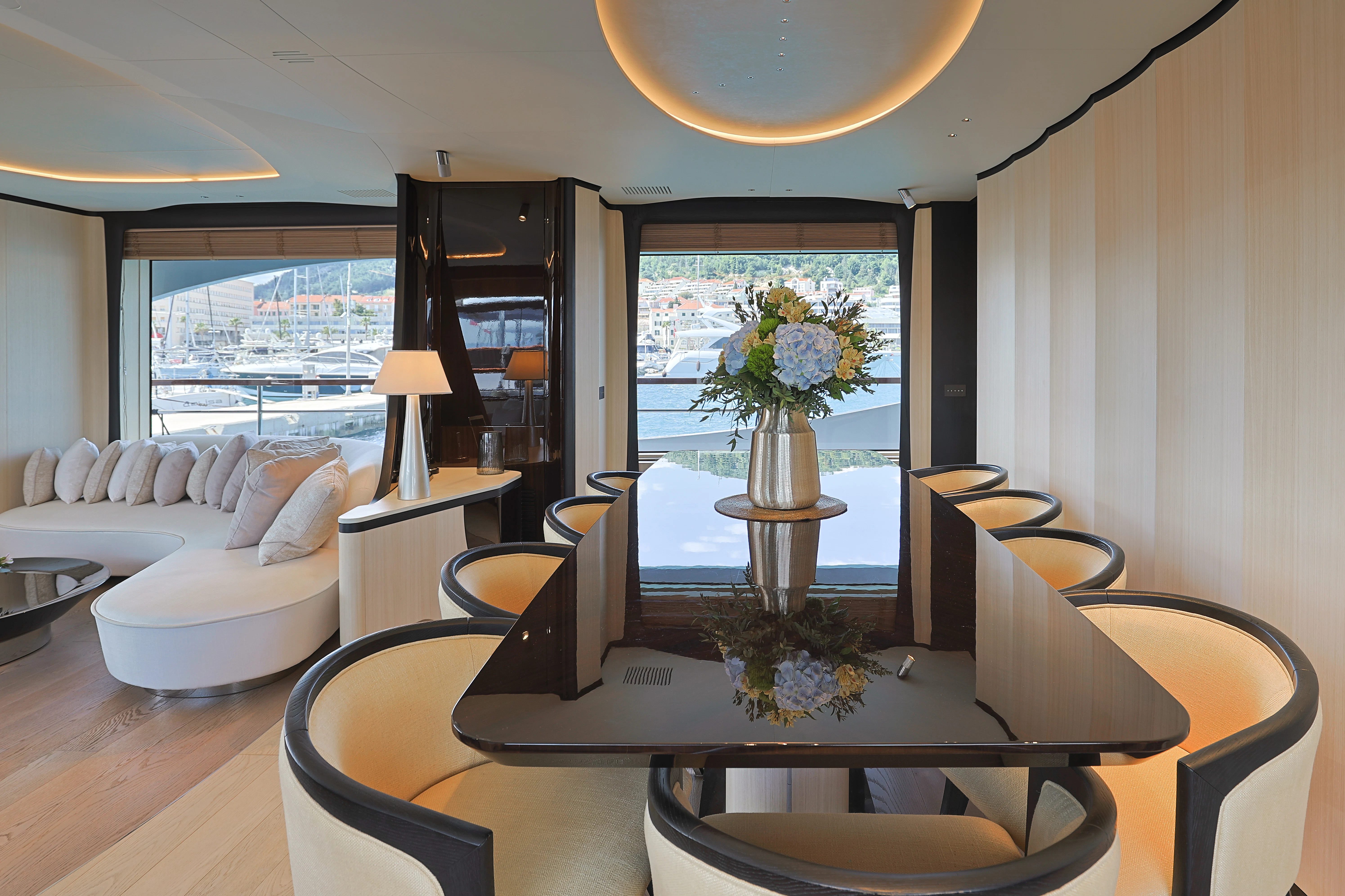 a living room with a large window aboard BELLA VITA Yacht for Charter