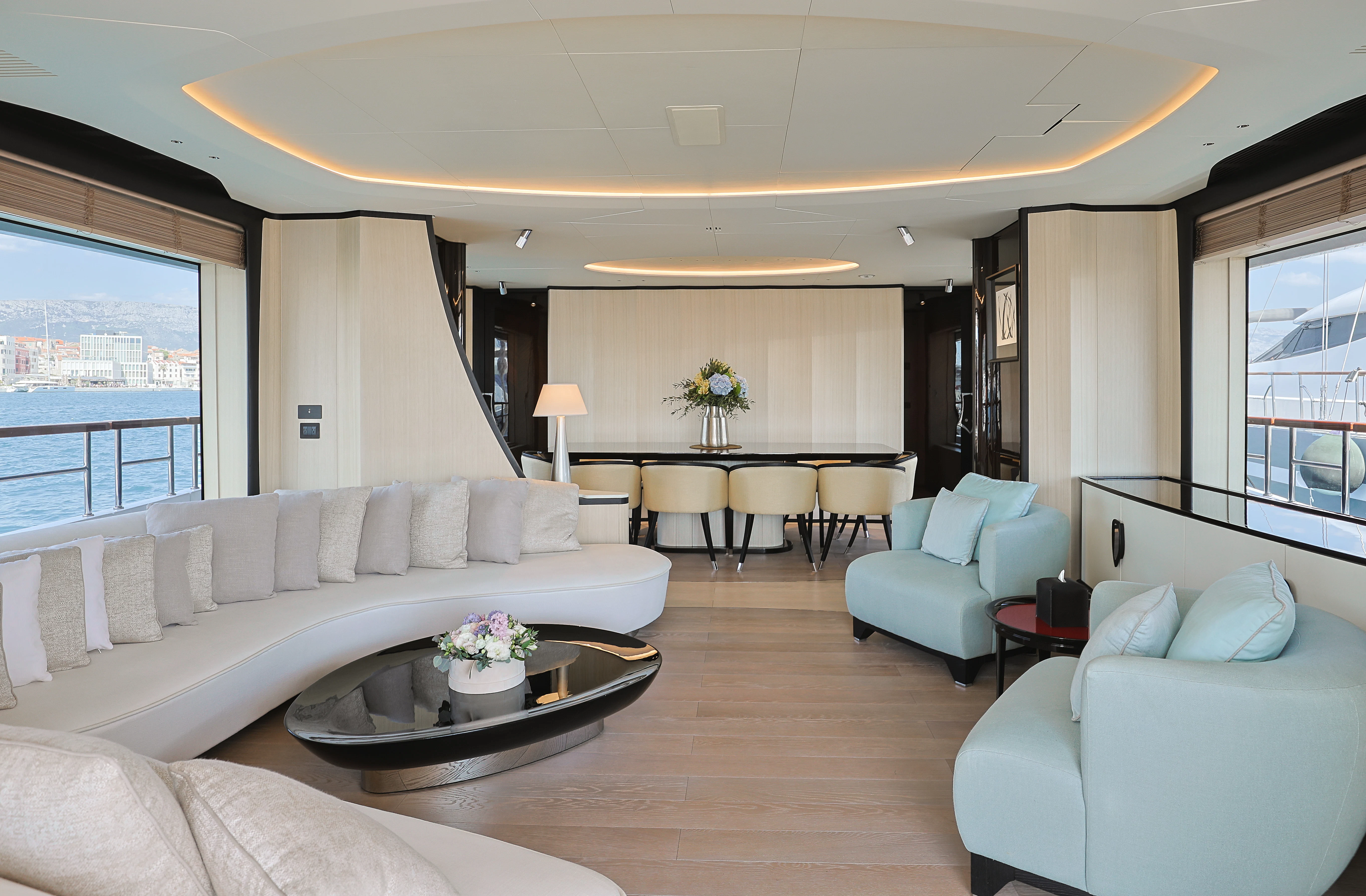 a living room with a couch and a coffee table aboard BELLA VITA Yacht for Charter