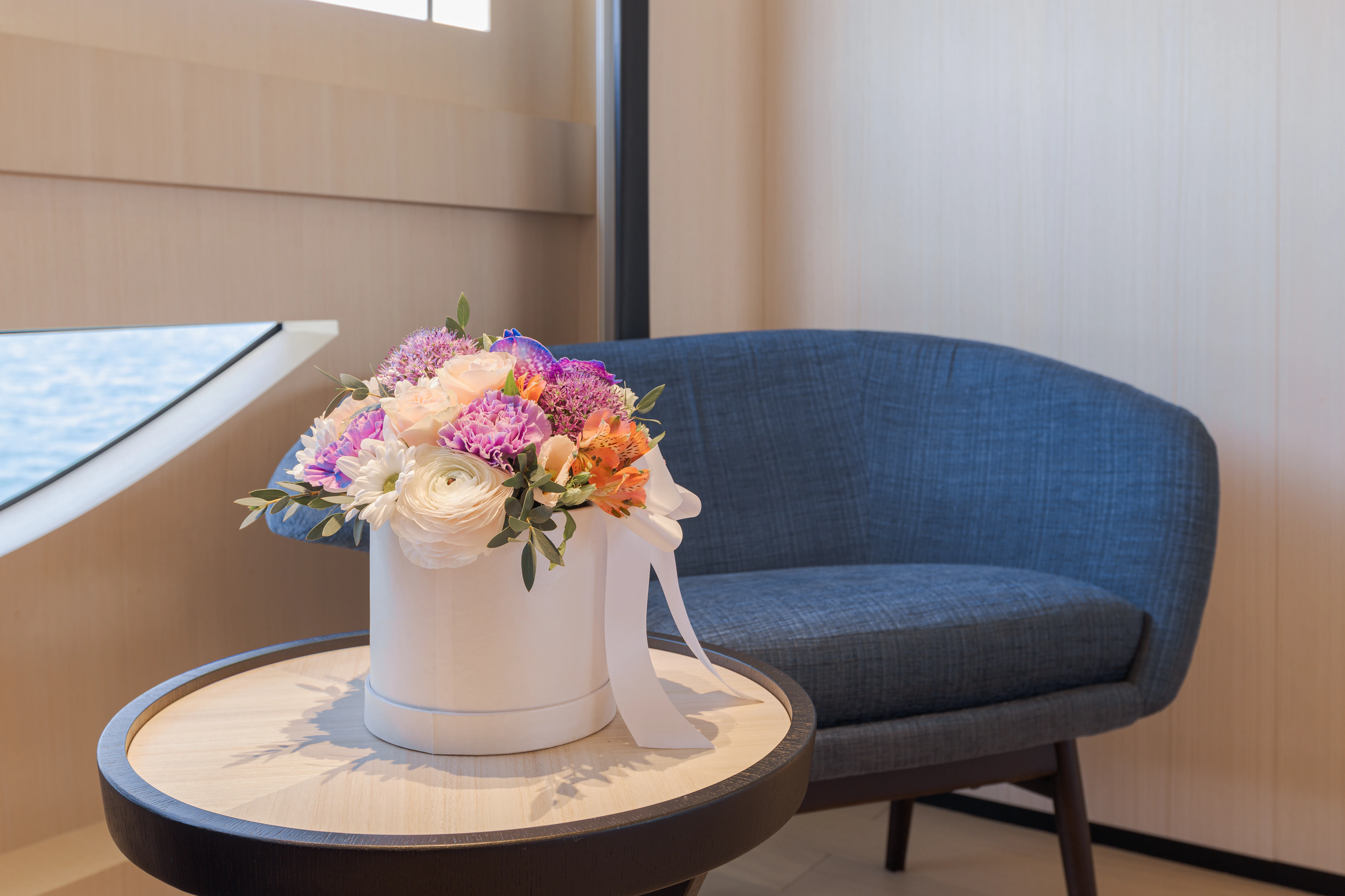 a vase with flowers in it aboard BELLA VITA Yacht for Charter