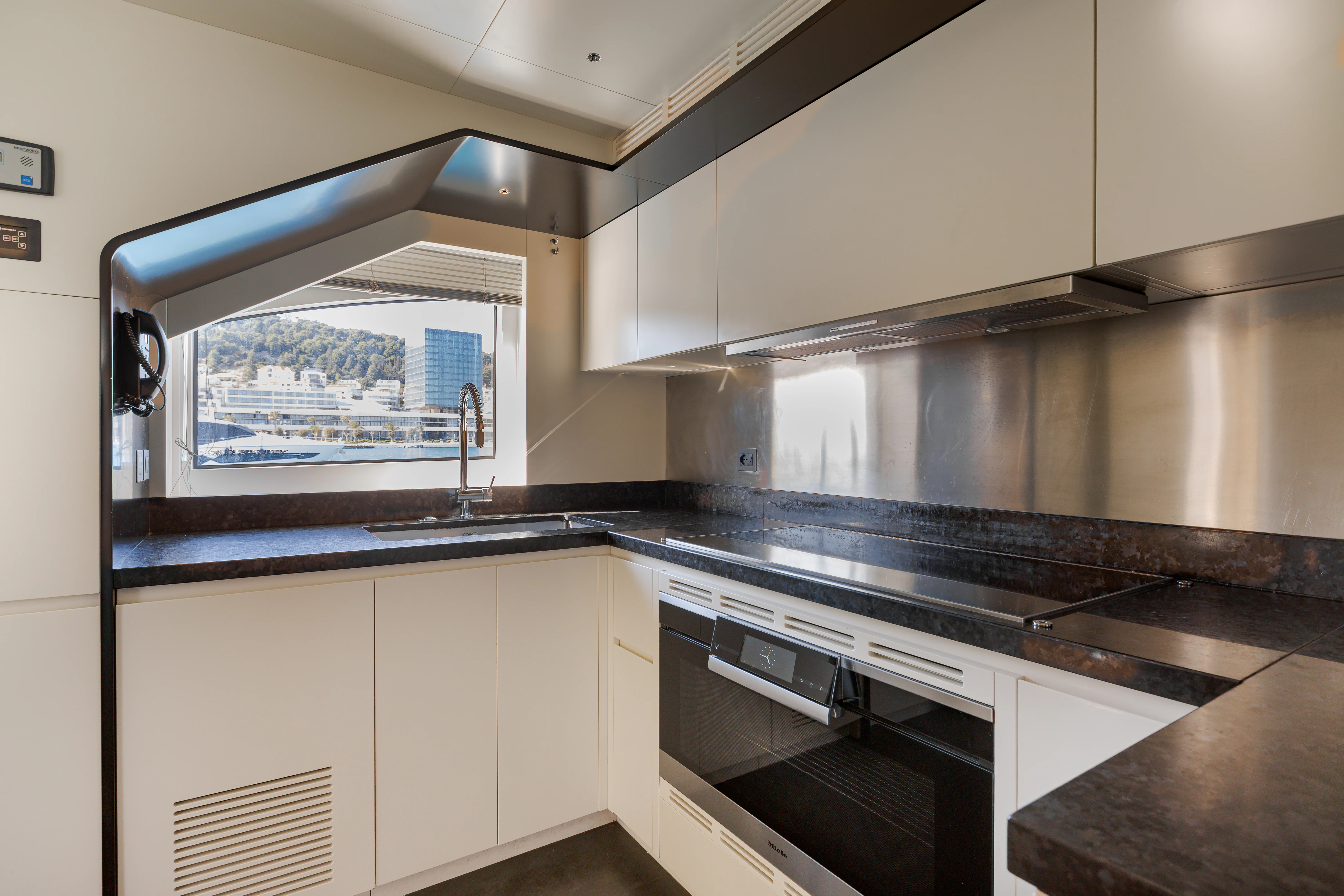 a kitchen with a window aboard BELLA VITA Yacht for Charter