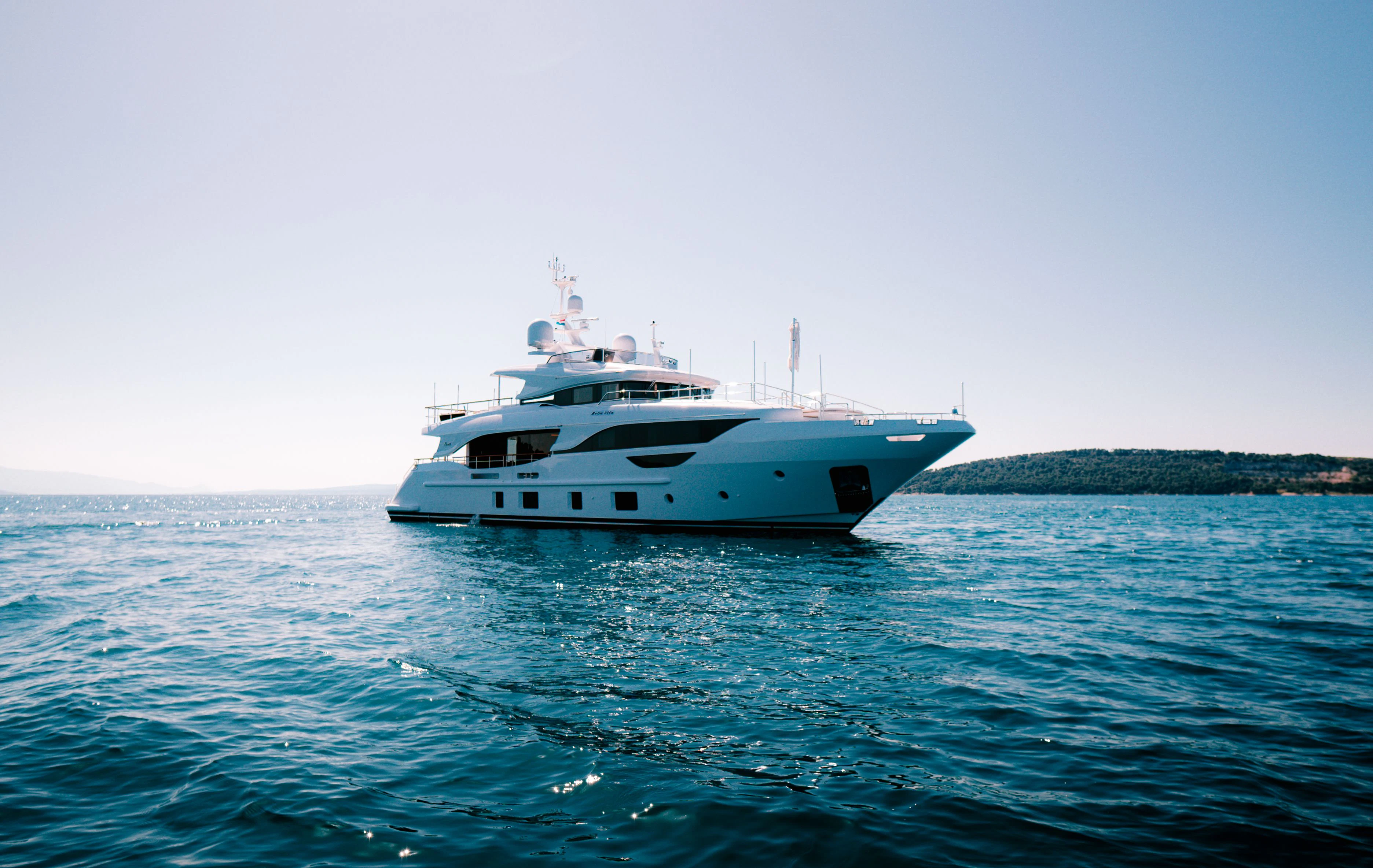 a white boat in the water aboard BELLA VITA Yacht for Charter