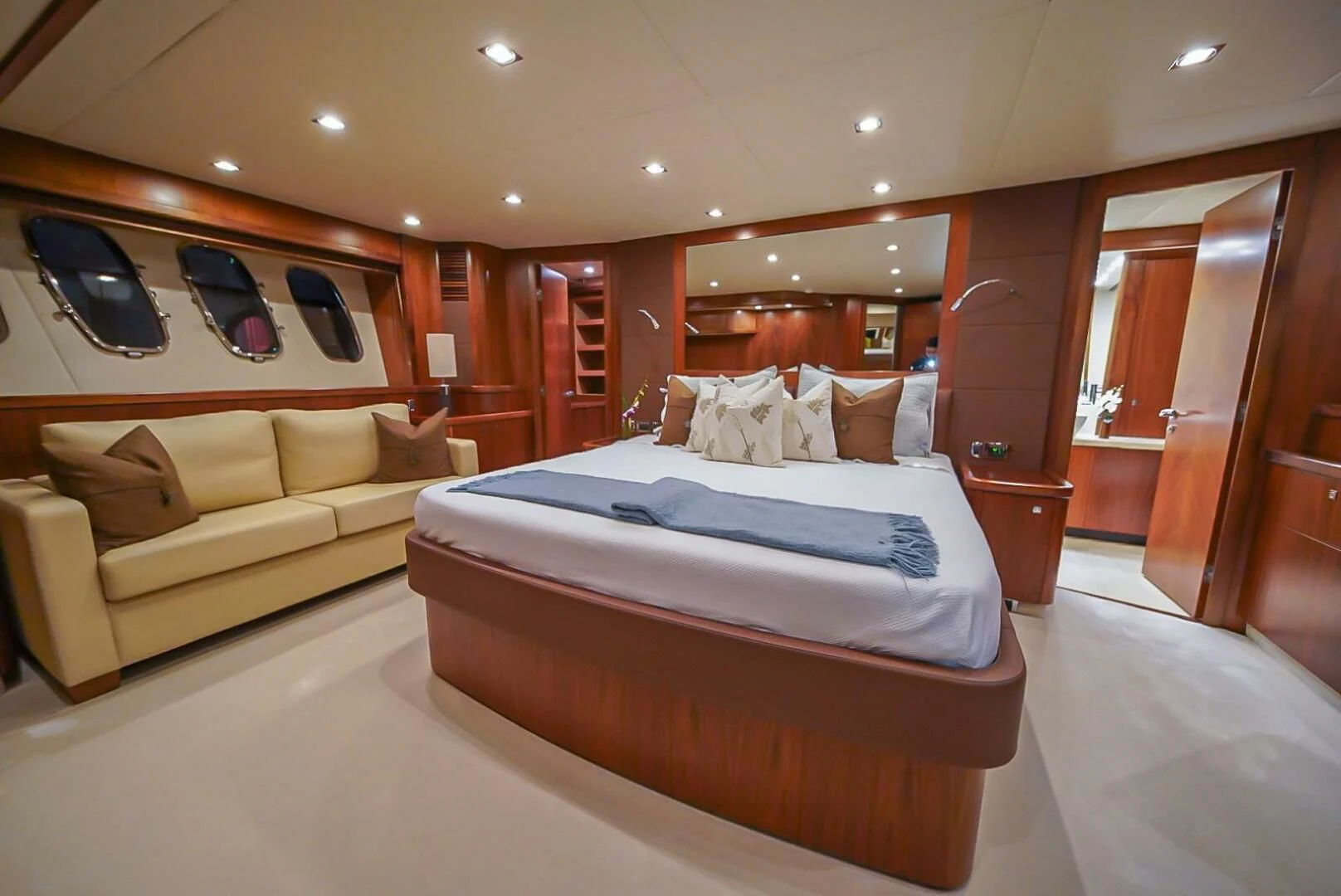 a room with a bed and a couch aboard EL TIO Yacht for Sale