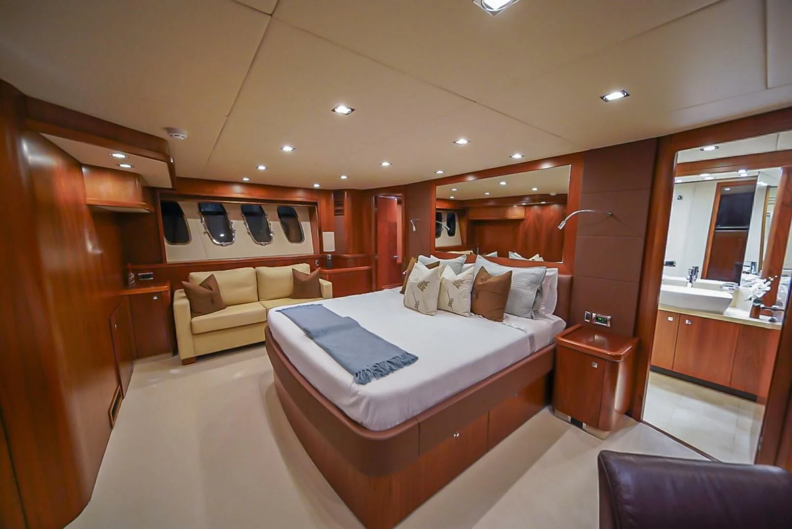 a room with a bed and a mirror aboard EL TIO Yacht for Sale