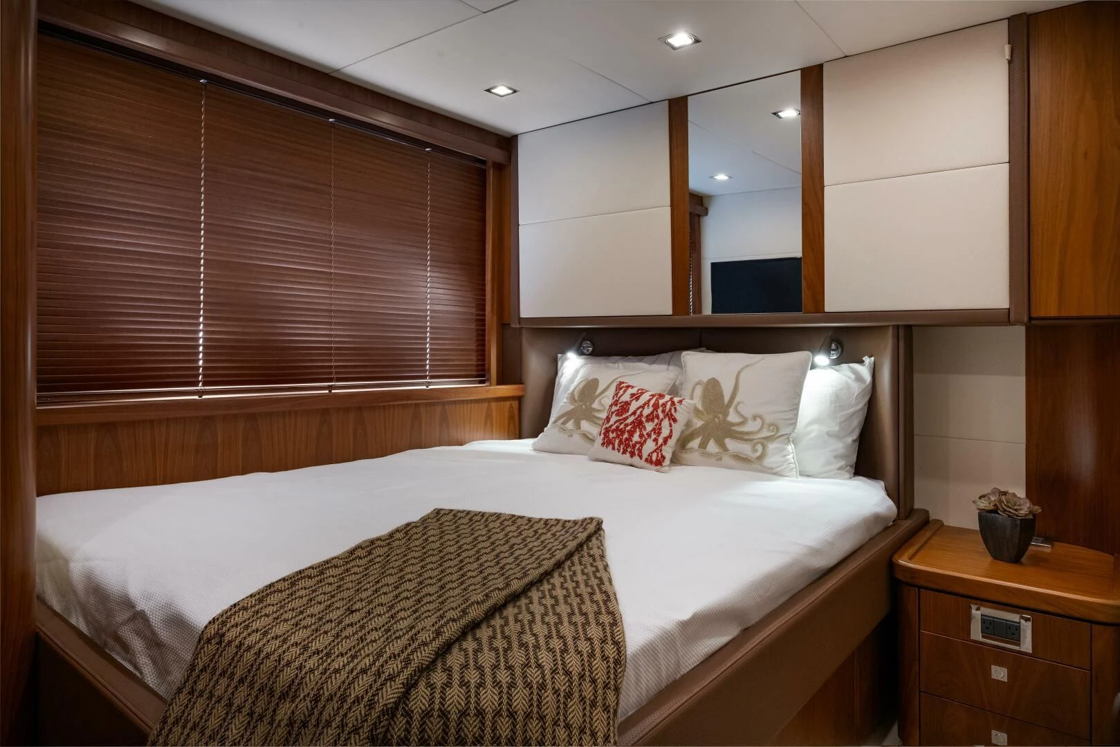 a bed with a white sheet and pillows aboard EL TIO Yacht for Sale