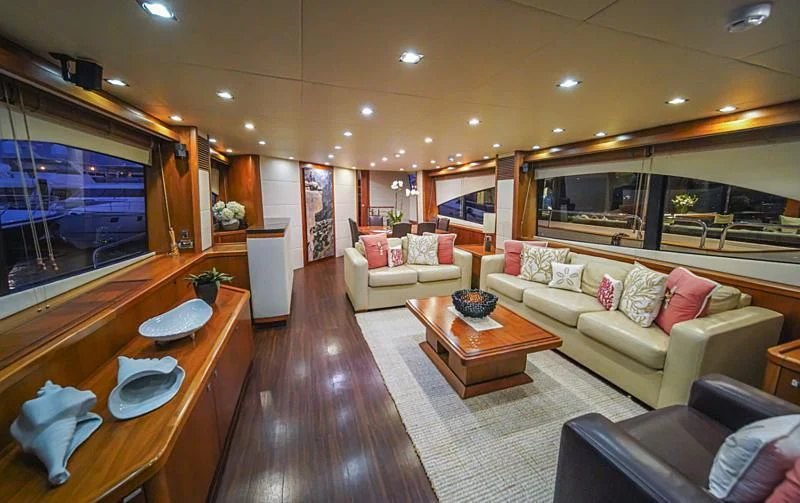 a living room with a large screen aboard EL TIO Yacht for Sale
