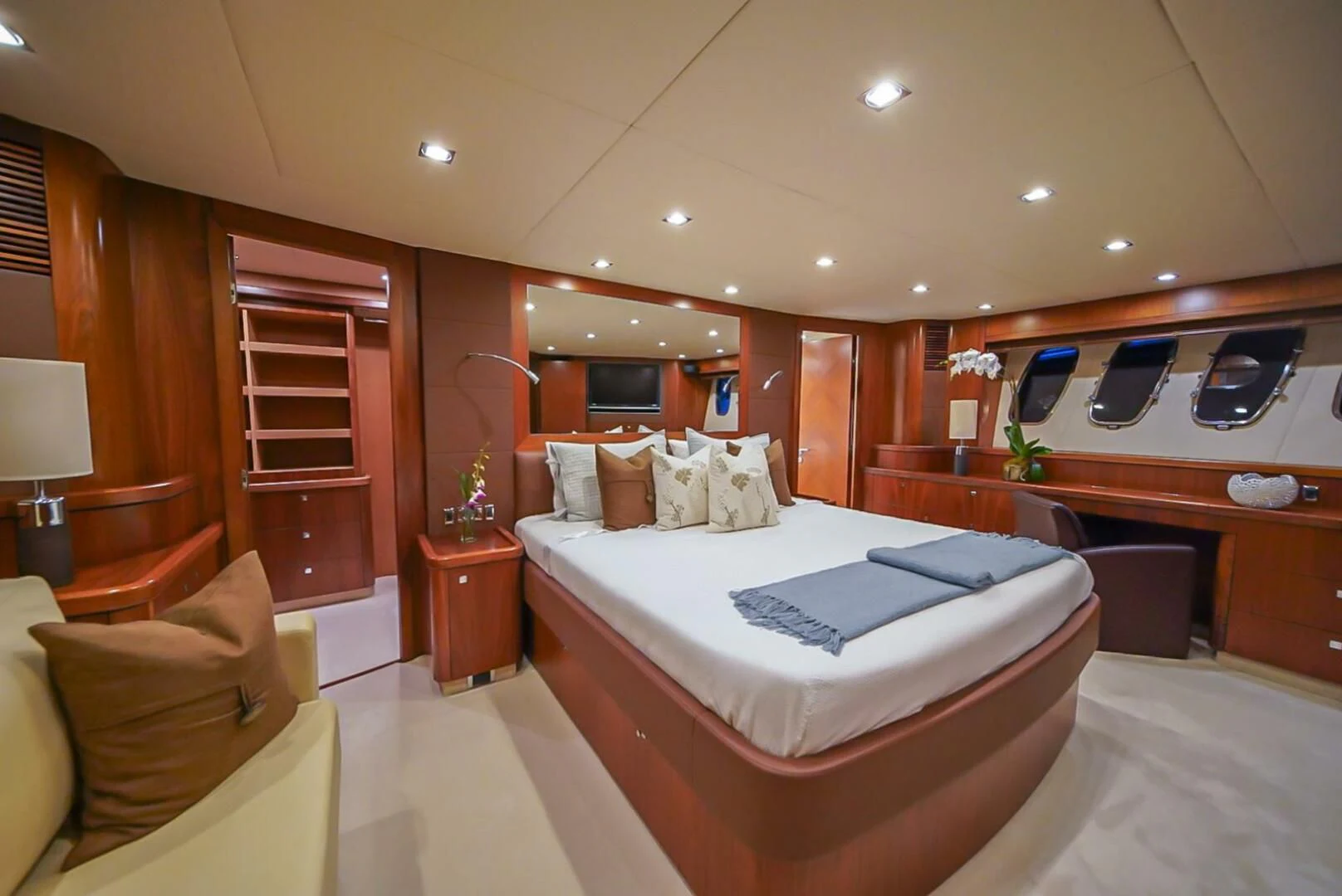 a room with a bed and a chair aboard EL TIO Yacht for Sale