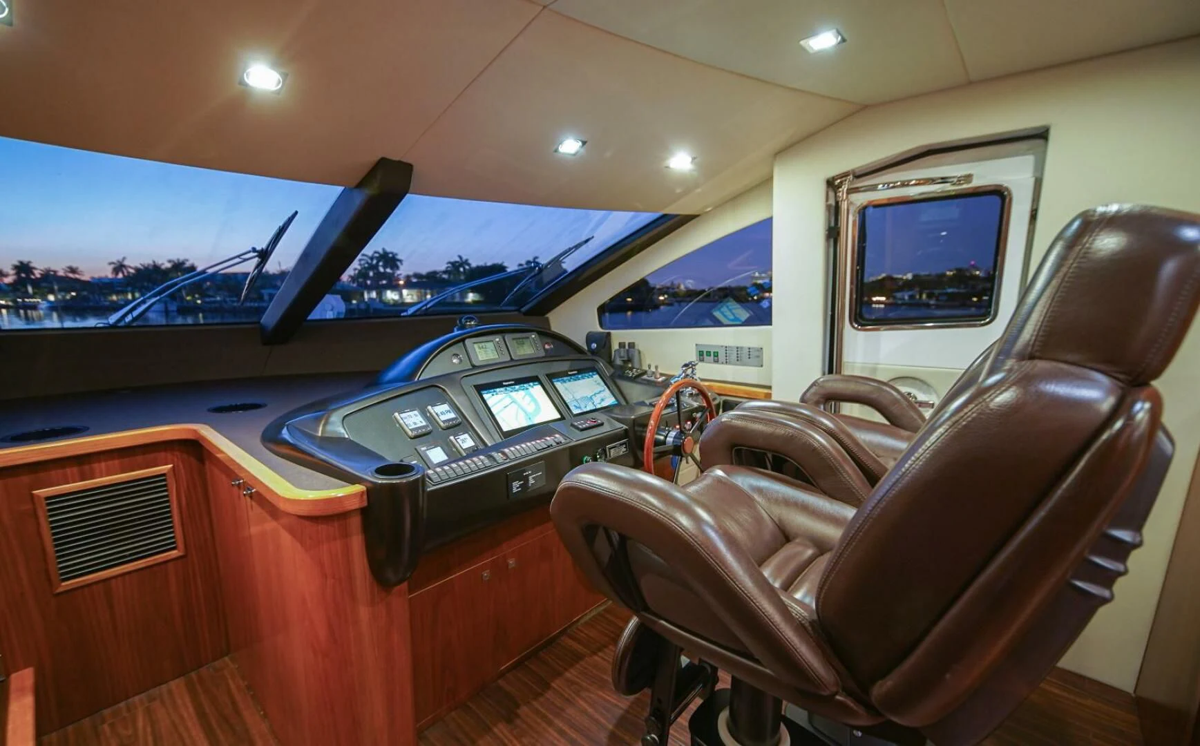 a room with a desk and chairs aboard EL TIO Yacht for Sale