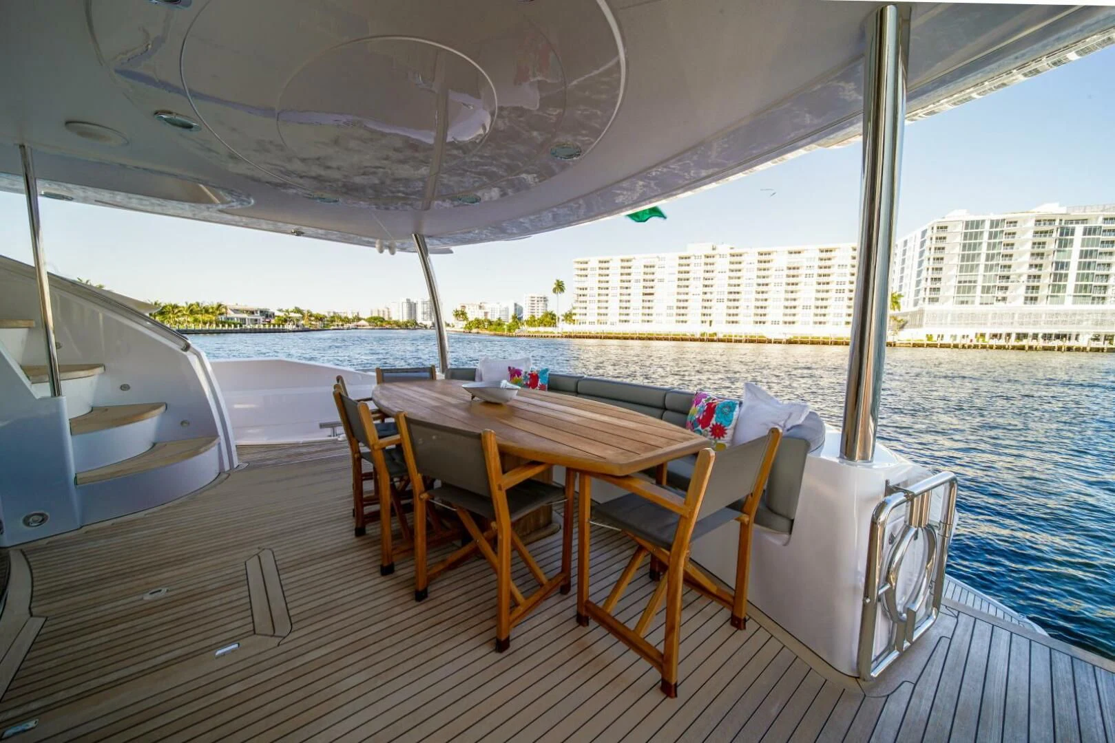a table and chairs on a deck aboard EL TIO Yacht for Sale