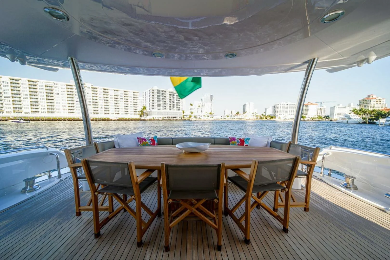 a table on a deck overlooking a body of water aboard EL TIO Yacht for Sale