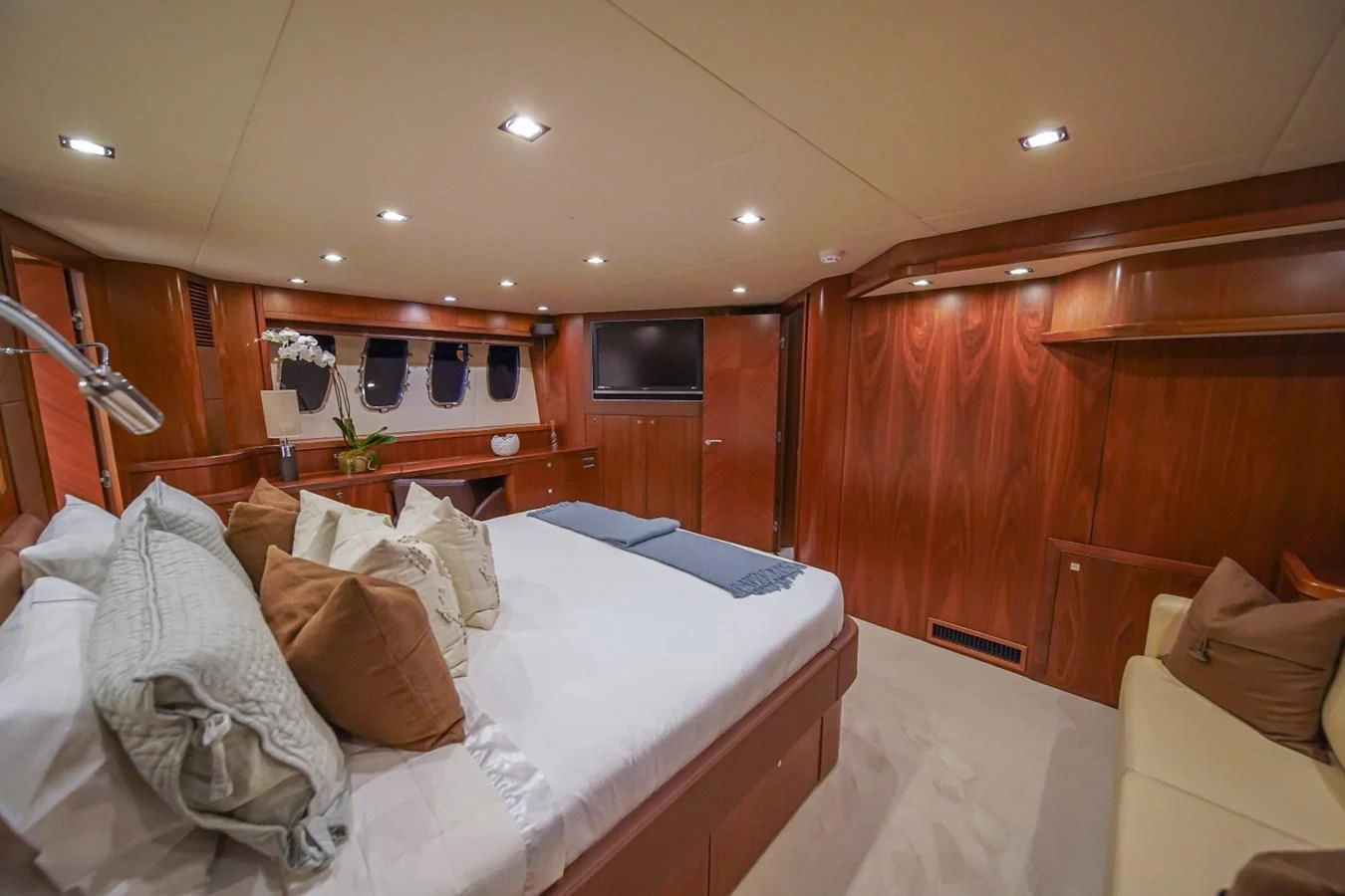 a room with a bed and a wood wall aboard EL TIO Yacht for Sale