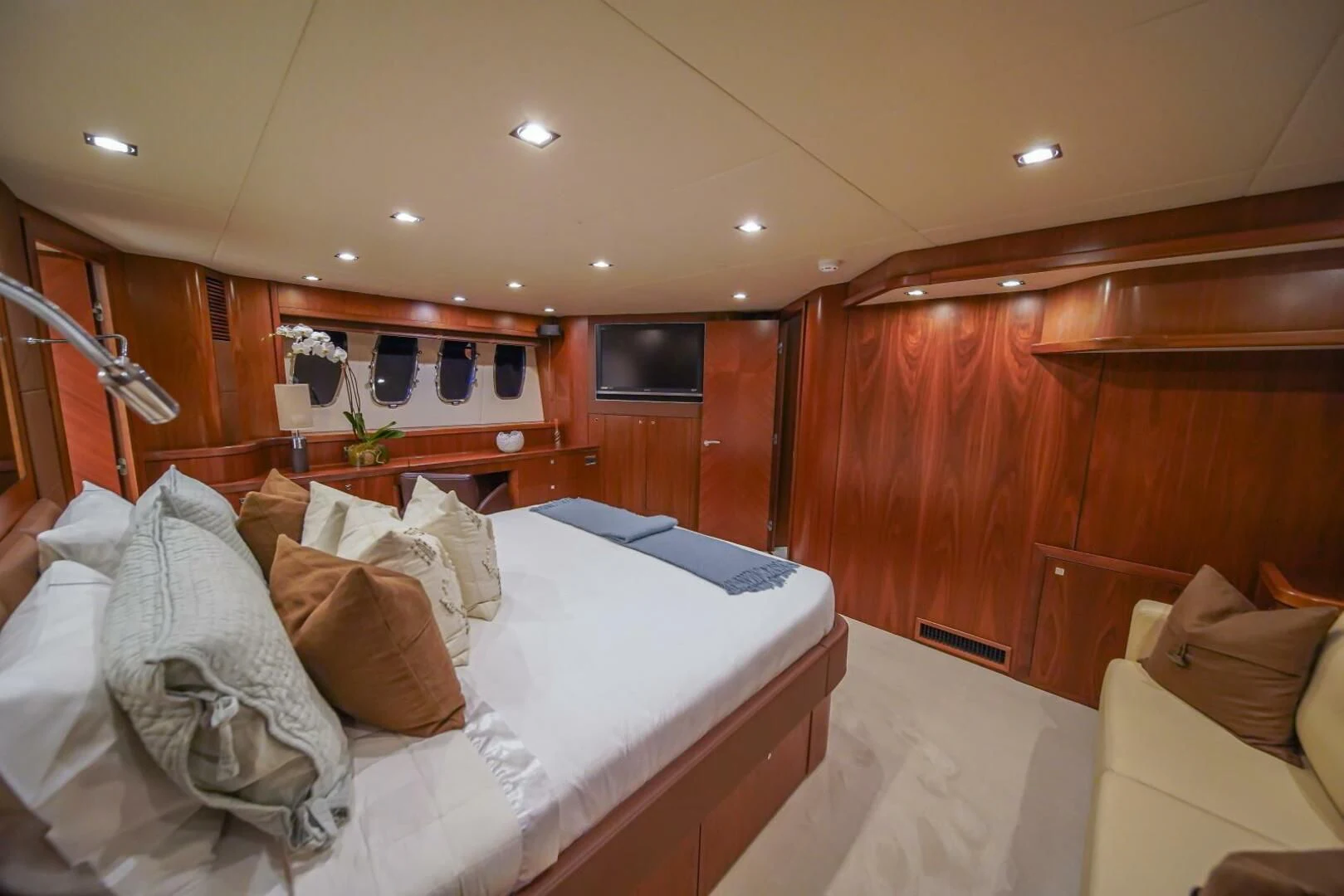 a room with a bed and a wood wall aboard EL TIO Yacht for Sale