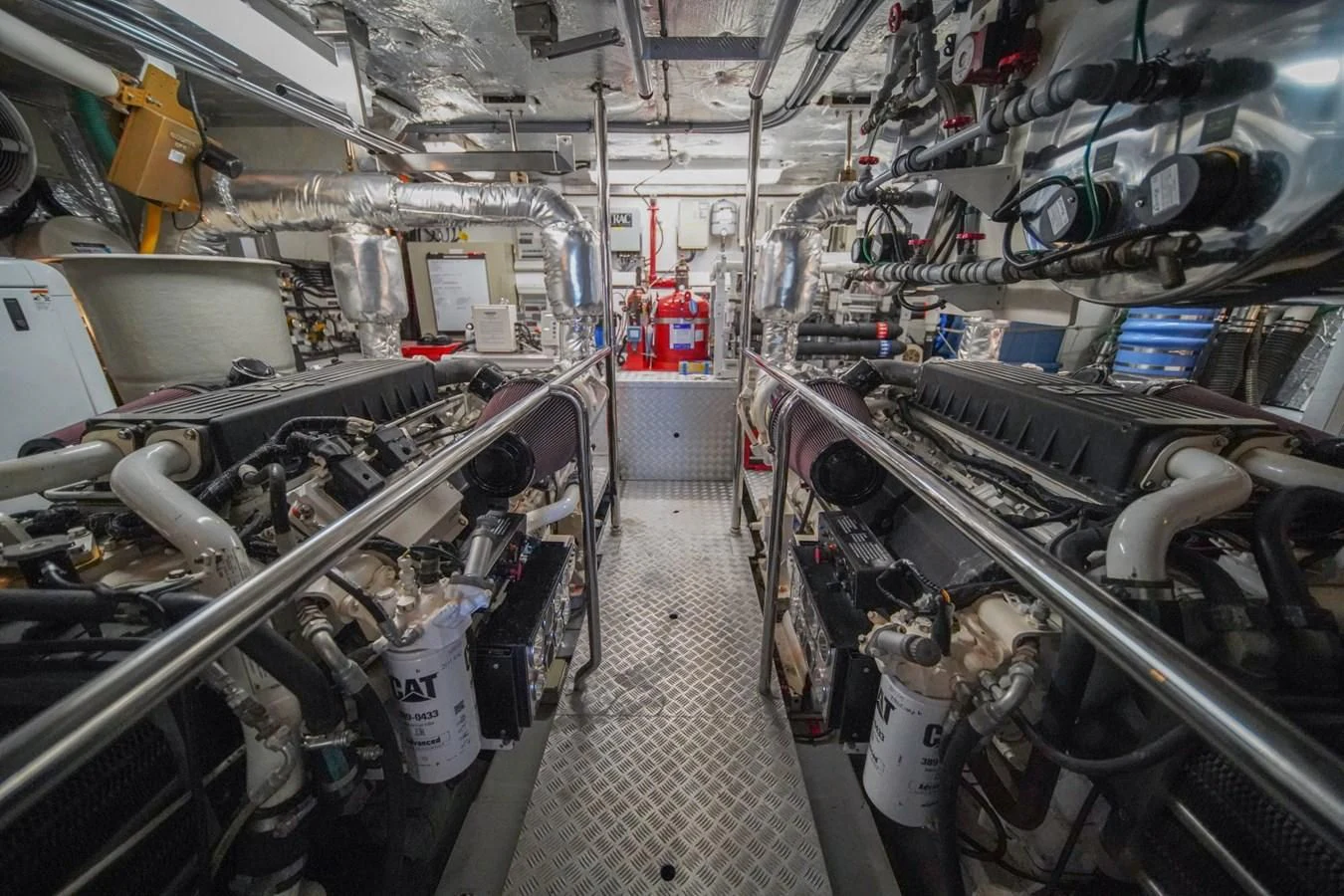 a room with many pipes and machinery aboard EL TIO Yacht for Sale