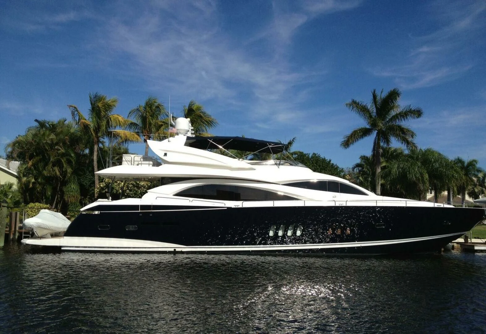 a white yacht on the water aboard EL TIO Yacht for Sale