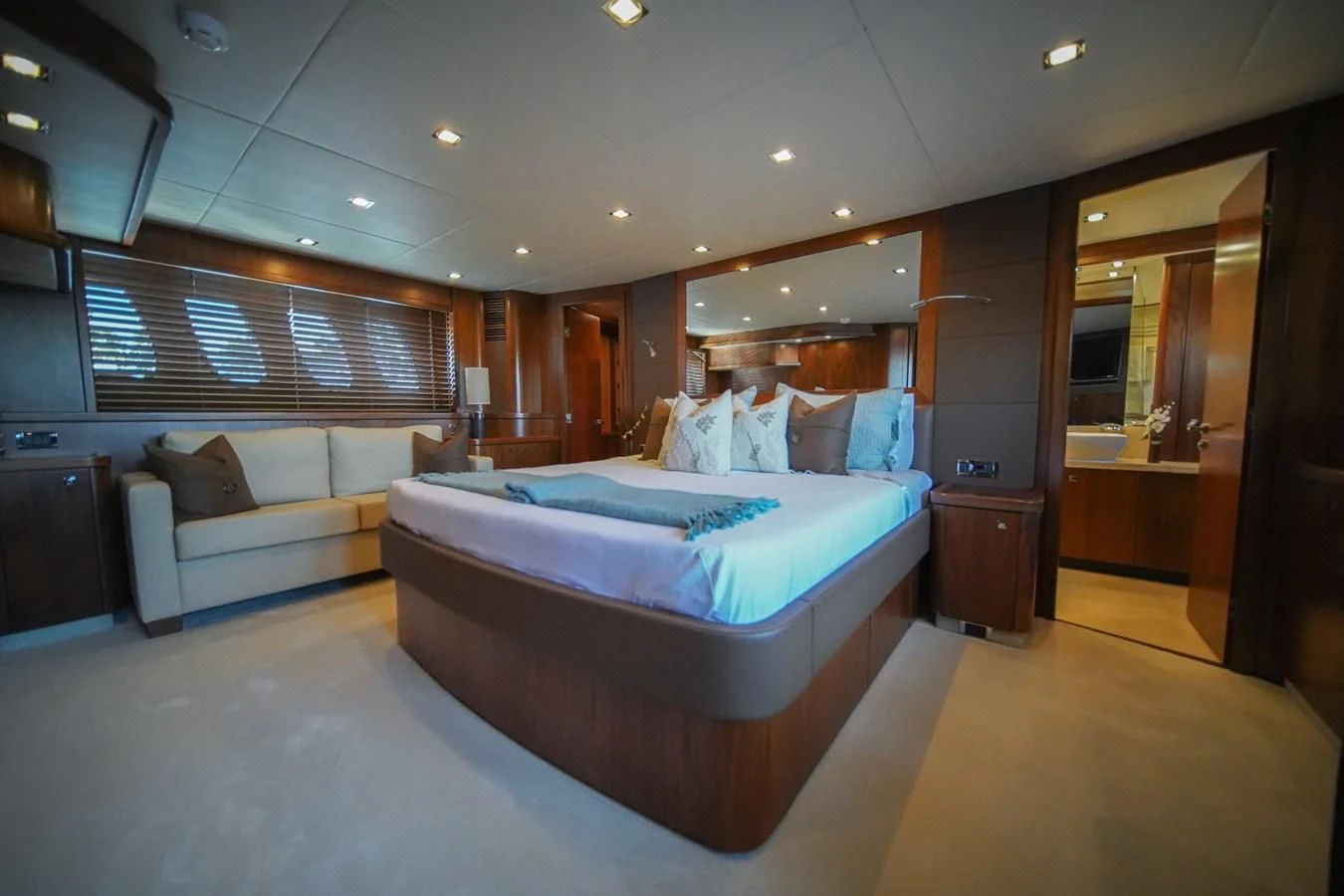 a room with a bed and a couch aboard EL TIO Yacht for Sale