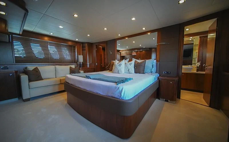 a large bedroom with a bed aboard EL TIO Yacht for Sale