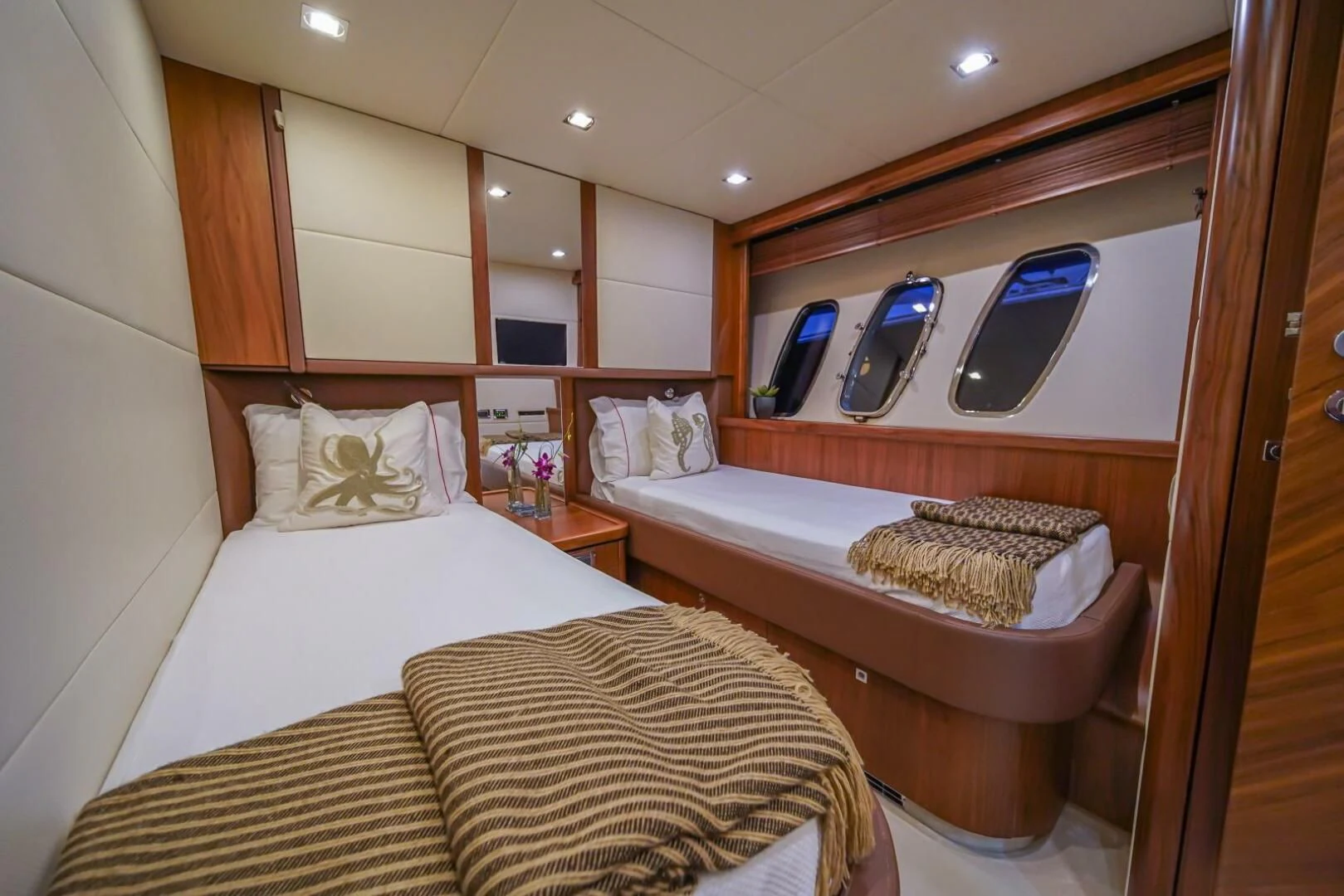 a room with two beds aboard EL TIO Yacht for Sale