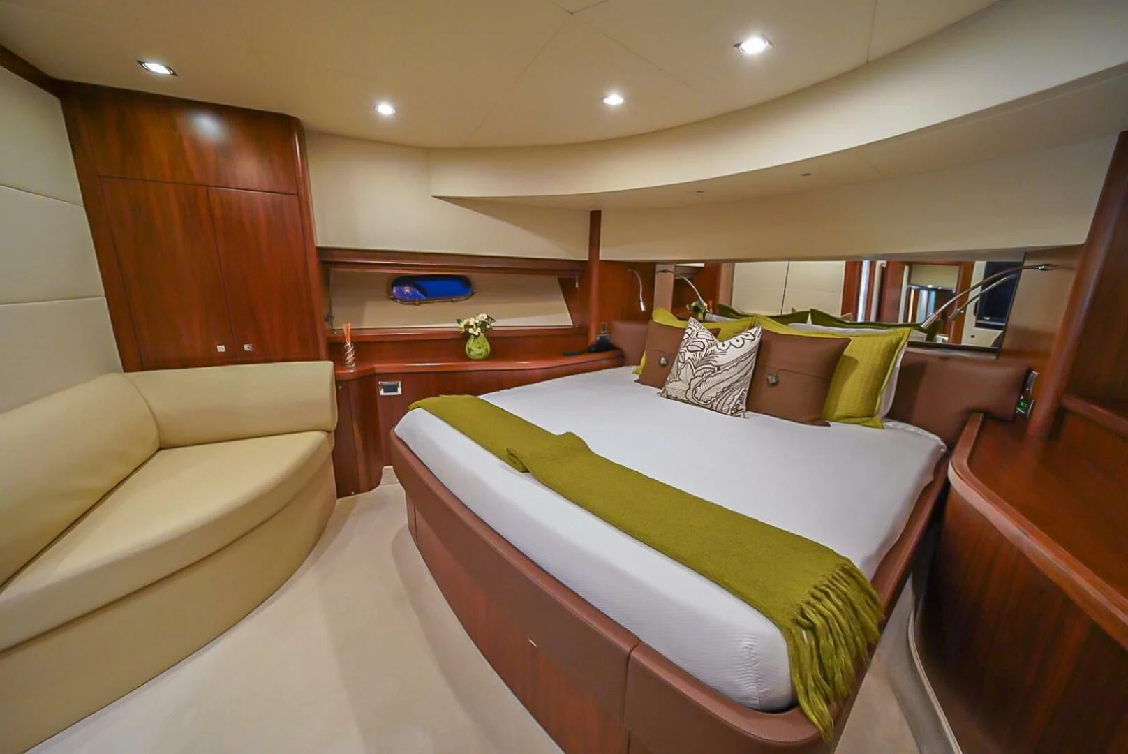 a room with a bed and a couch aboard EL TIO Yacht for Sale