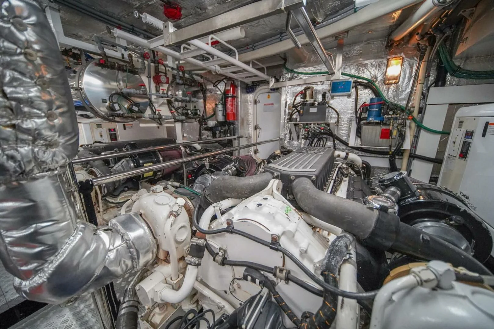 a room full of pipes and machinery aboard EL TIO Yacht for Sale