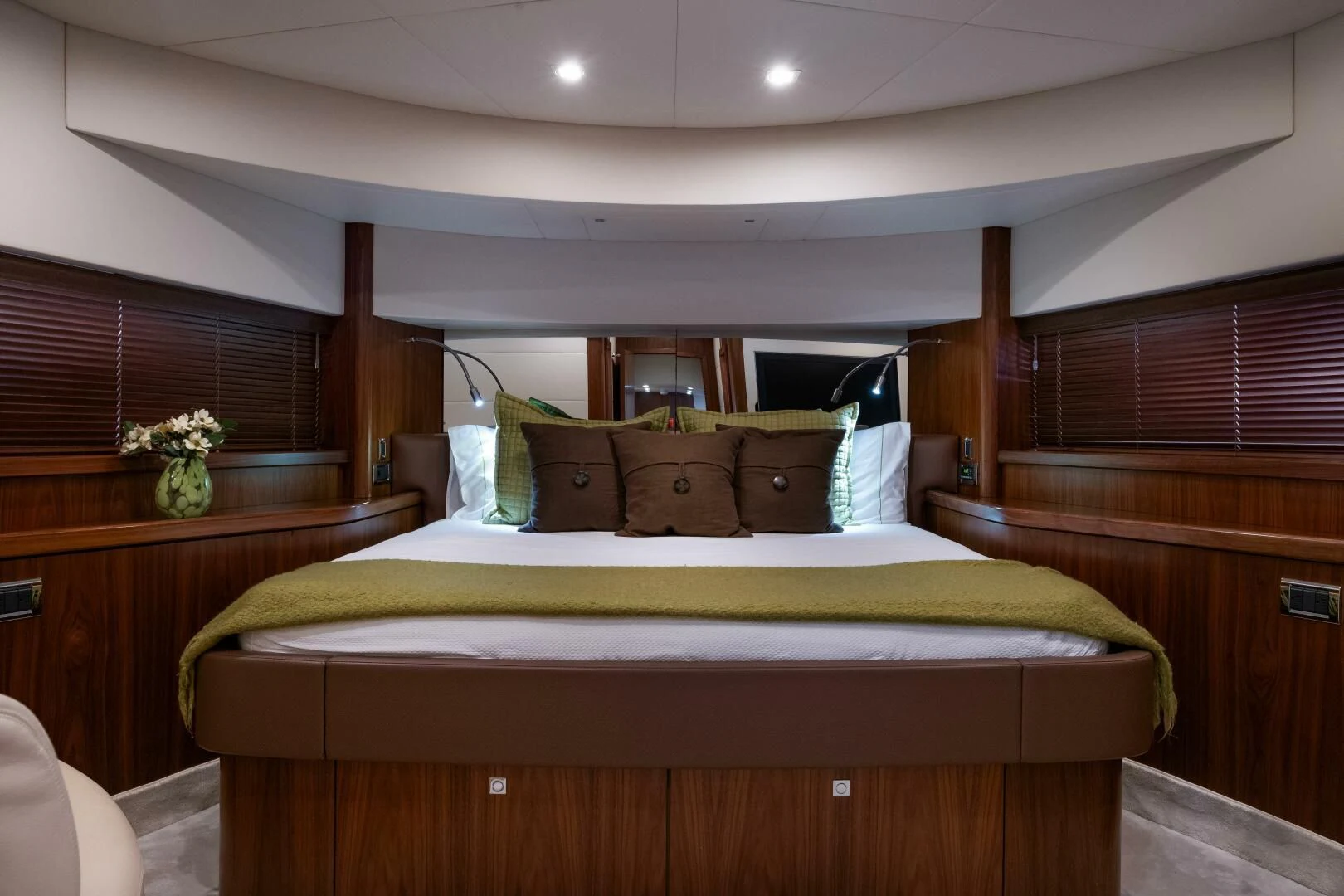 a bed with a wood headboard aboard EL TIO Yacht for Sale