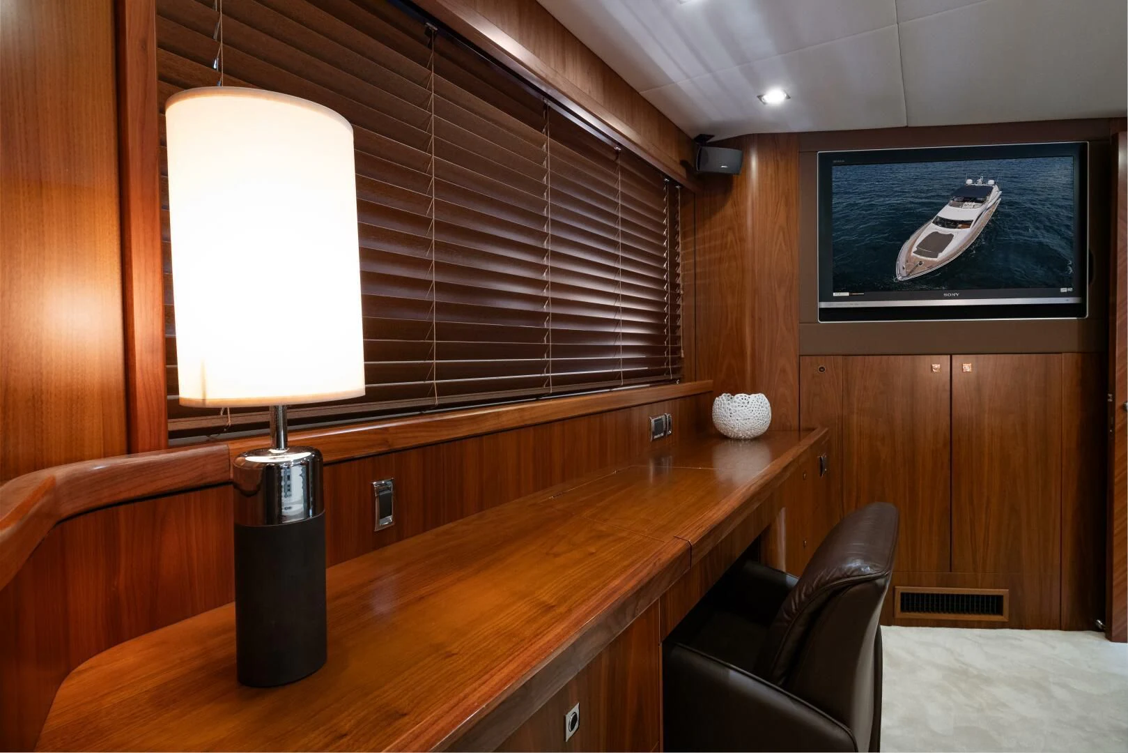 a room with a tv and a bed aboard EL TIO Yacht for Sale