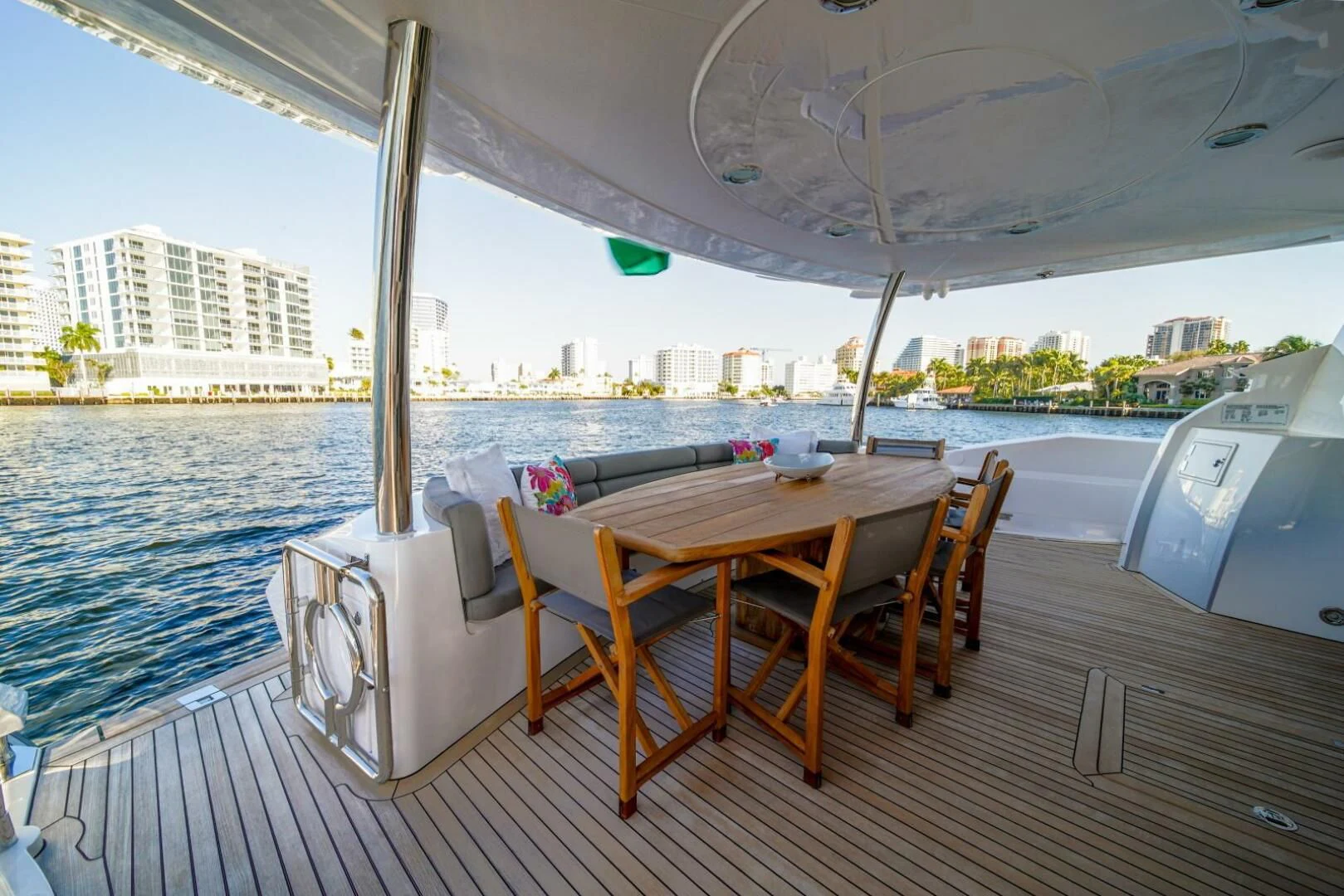 a table and chairs on a deck aboard EL TIO Yacht for Sale
