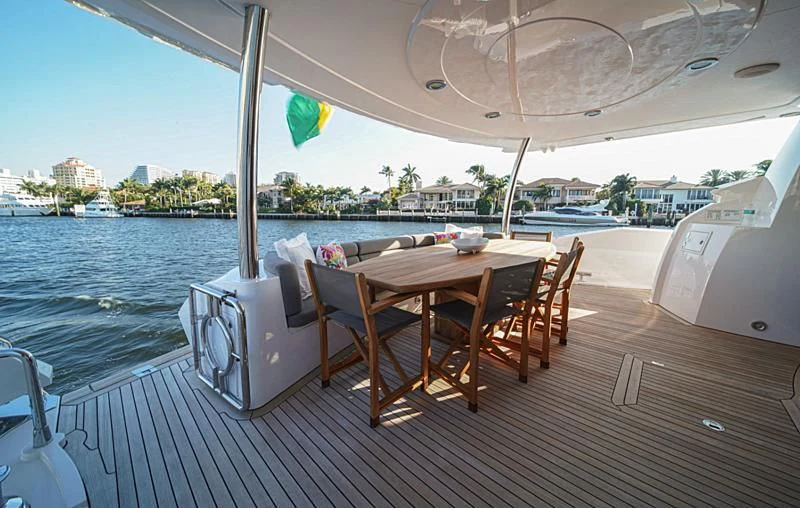 a table on a deck aboard EL TIO Yacht for Sale