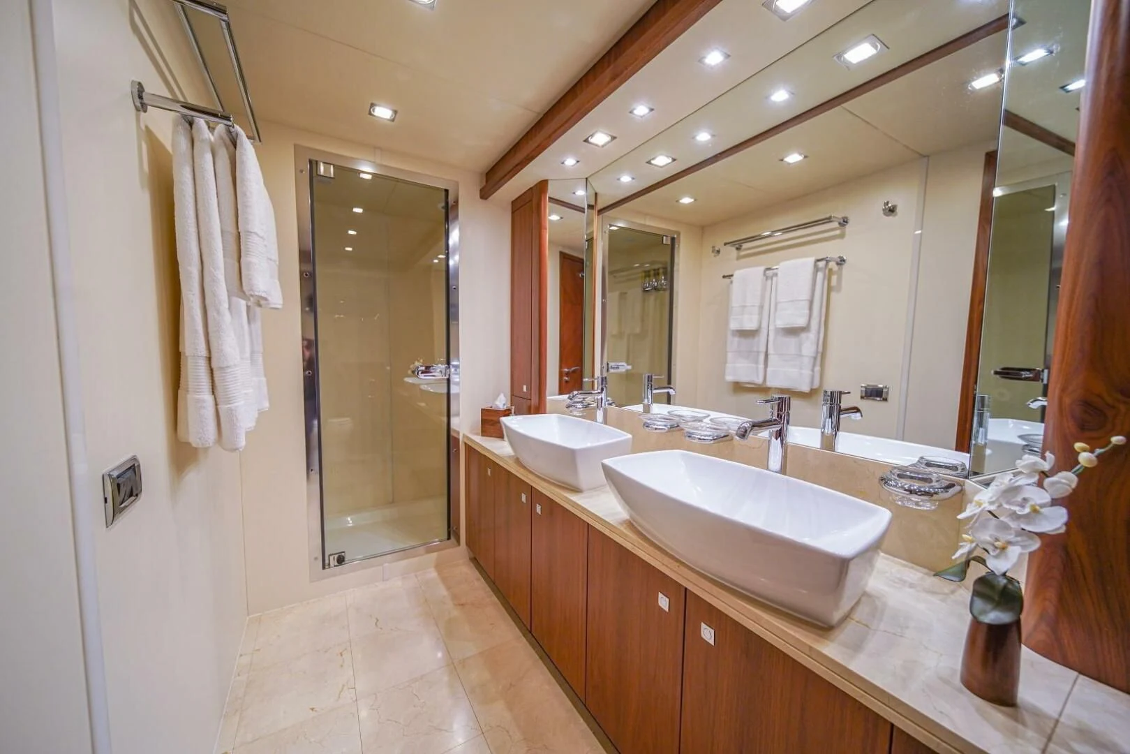 a bathroom with a large mirror aboard EL TIO Yacht for Sale
