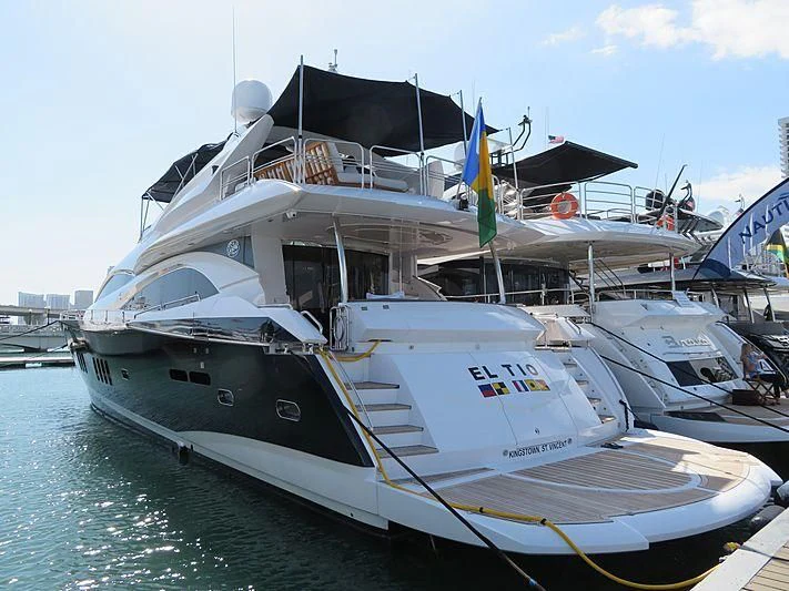 a boat docked at a pier aboard EL TIO Yacht for Sale