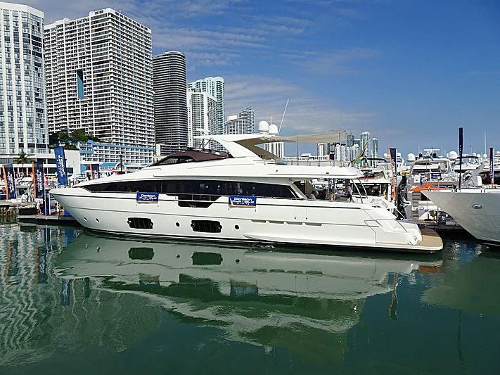 a couple of boats in a harbor aboard CLUB M Yacht for Sale