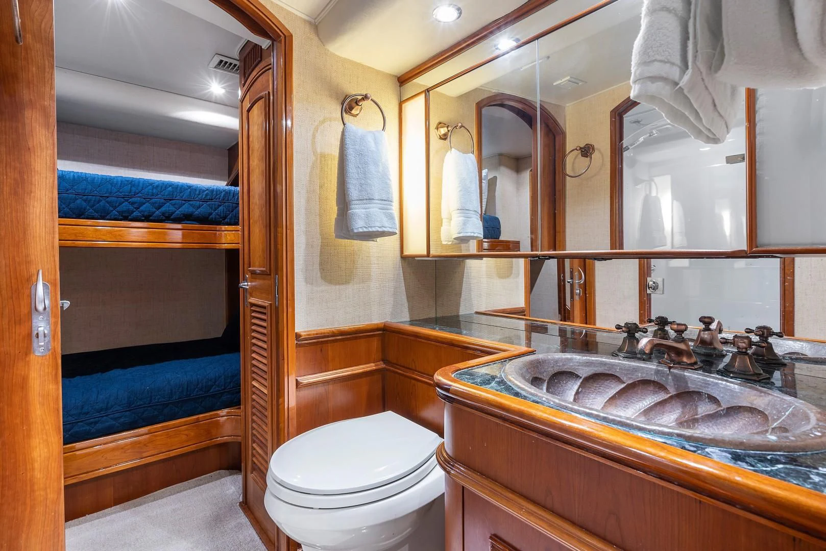 a bathroom with a sink and a toilet aboard PAST TIME Yacht for Sale