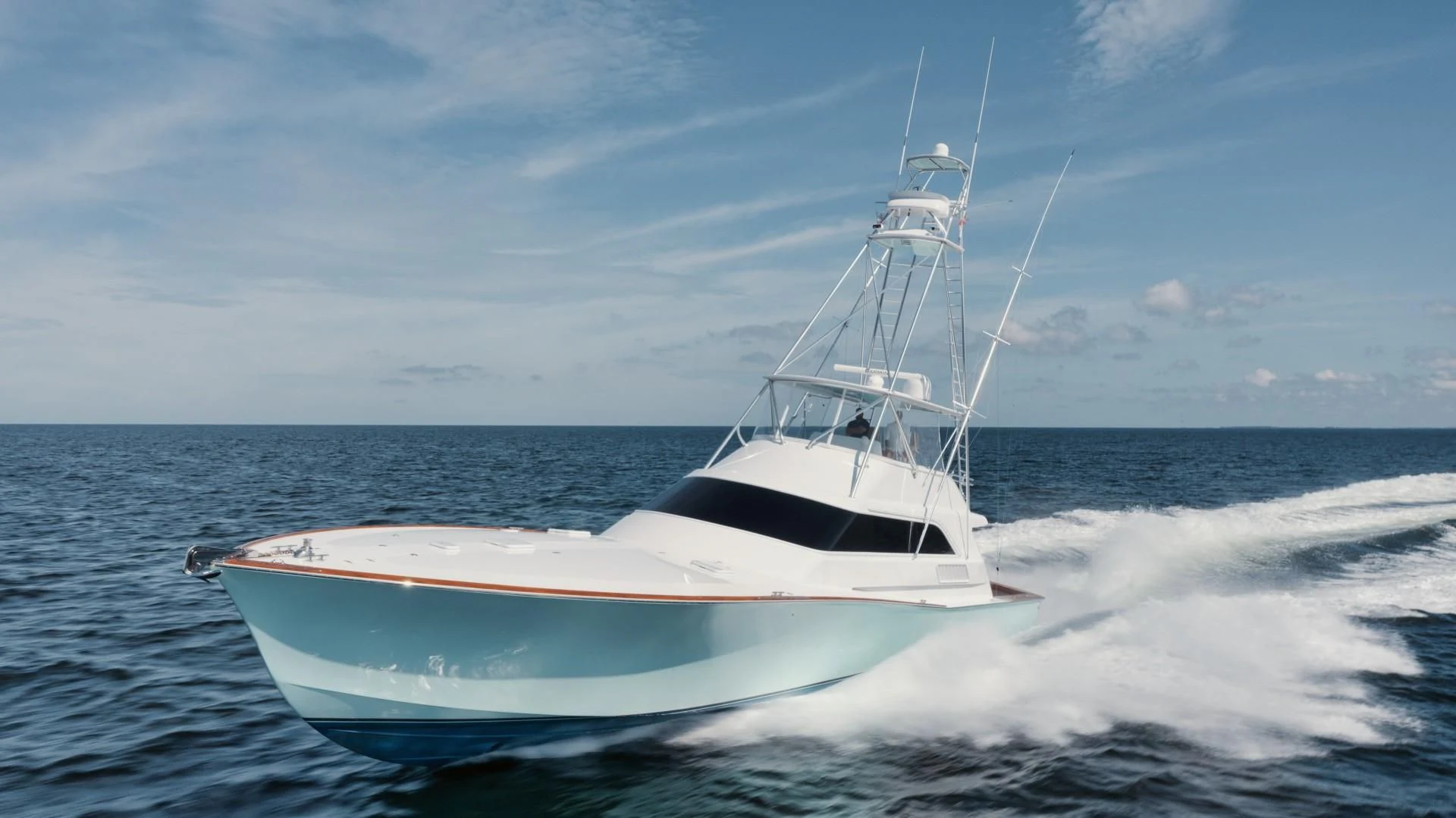 a white boat on the water aboard PAST TIME Yacht for Sale