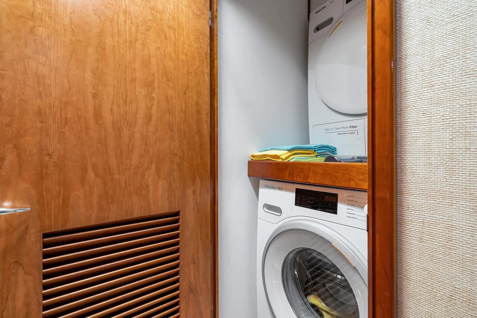 a door with a washing machine aboard PAST TIME Yacht for Sale