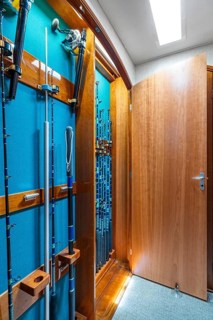 a room with a blue door and a mirror aboard PAST TIME Yacht for Sale