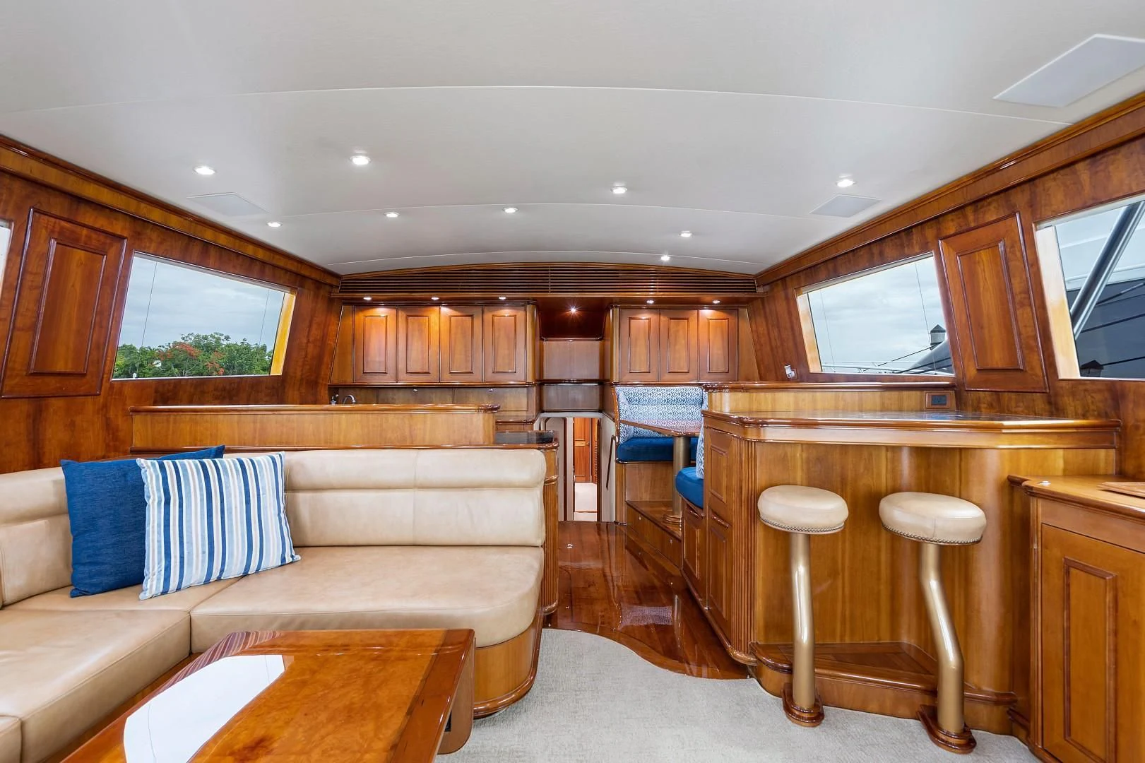 a living room with wood cabinets aboard PAST TIME Yacht for Sale