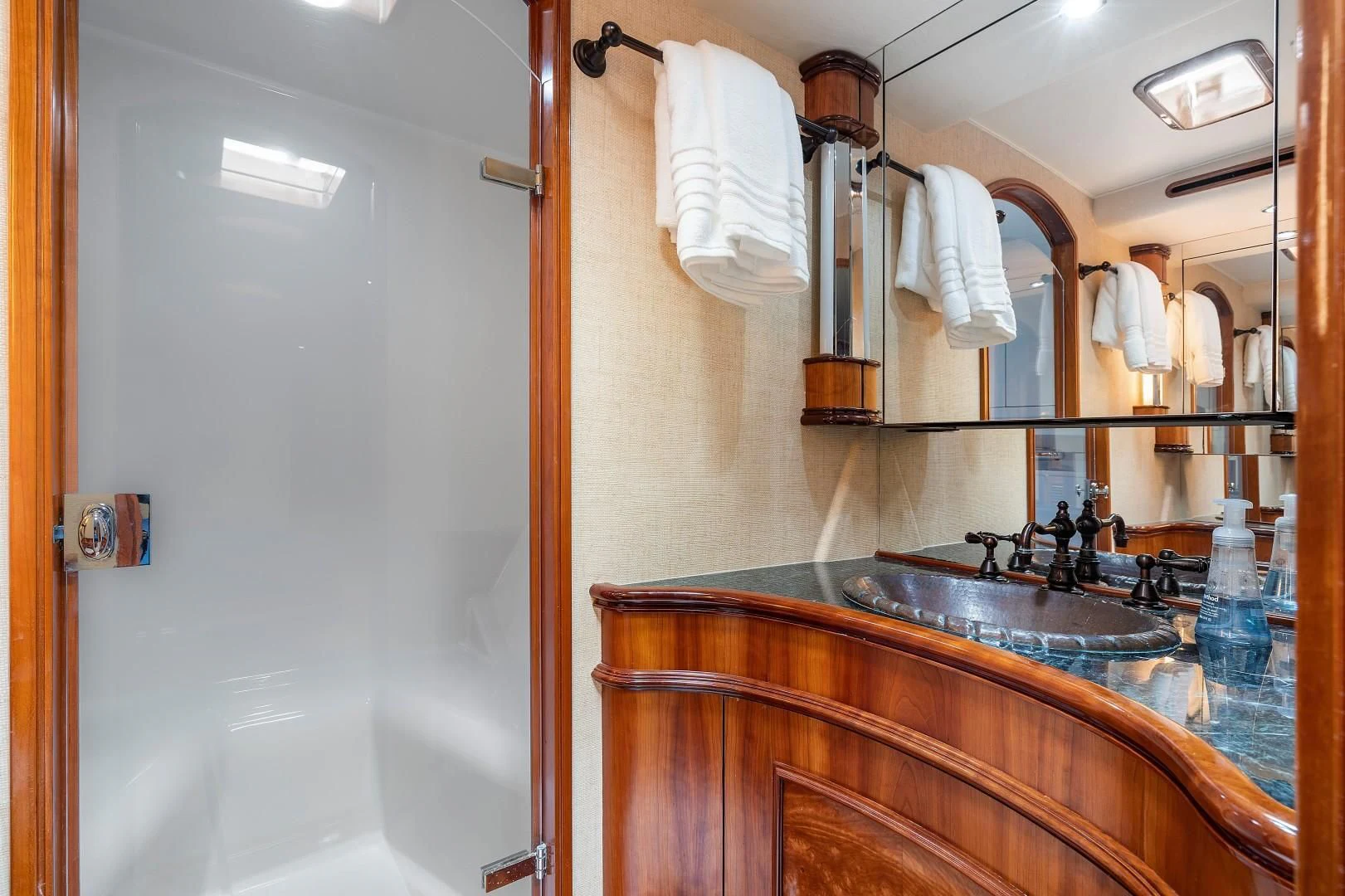 a bathroom with a sink and a mirror aboard PAST TIME Yacht for Sale